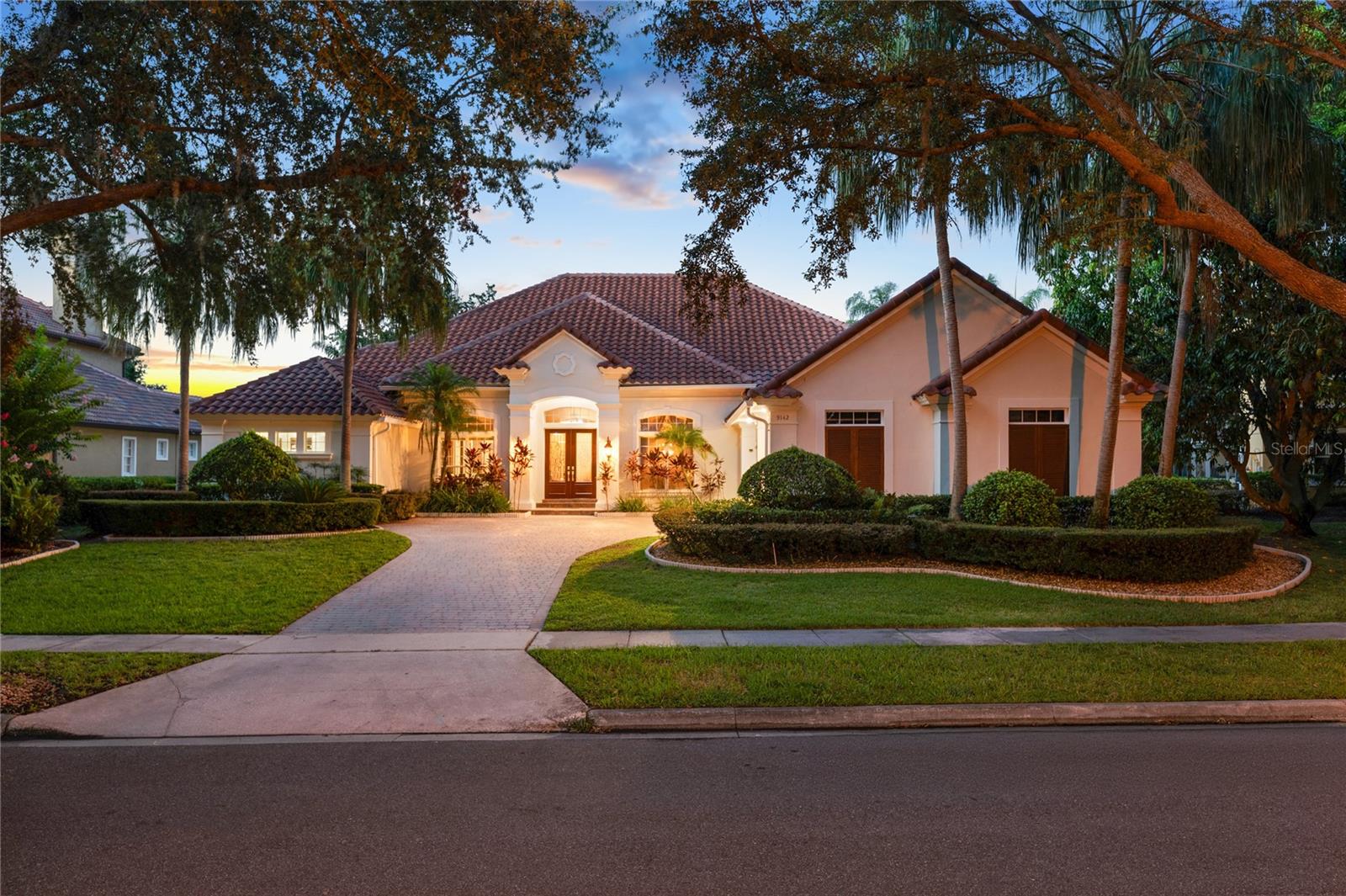 Discover refined living in this exceptional one-story estate, positioned within the highly sought after guard-gated community of Phillip's Landing. This beautifully updated residence blends timeless elegance with modern sophistication. From the moment you arrive, you'll be captivated by the homes impeccable curb appeal, featuring a freshly painted exterior, meticulous landscaping, and a new roof installed in 2020. This remarkable home features exquisite hand-painted murals throughout, transforming each room into a unique work of art and making the entire residence a true masterpiece in design and craftsmanship with designer finishes throughout. Inside, a welcoming open floor plan unfolds across generous living spaces enhanced by stunning architectural details, hand painted murals, high ceilings, and an abundance of natural light. This home features four bedrooms plus an office that could be used as a fifth bedroom and over 4,000 square feet of living space. The heart of the home is designed for entertaining, with formal living and dining rooms flowing seamlessly into a spacious family room. The chef's kitchen is a culinary masterpiece, featuring top of the line stainless-steel appliances, gleaming granite countertops with a waterfall edge, and a spacious center island perfect for both meal preparation and entertainment. Expansive French doors invite you to the outdoor sanctuary, where a sparkling pool with a spillover spa and dramatic water features create an ambiance of total relaxation. The freshly painted pool deck adds a clean, modern touch, perfect for elegant al fresco dining. The lavish primary suite is a true sanctuary, featuring a sprawling layout with a private sitting area, a spa-inspired bathroom featuring a large soaking tub, dual vanities, and a walk-in shower, and an enormous walk-in closet. Set on a quiet interior street within the gated community of Phillips Landing, this exceptional property offers not only security and comfort, but also a premier location just minutes from Restaurant Row, world class shopping, top-rated schools, championship golf courses, and all of the area attractions. Don't miss the opportunity to own this one-of-a-kind estate.