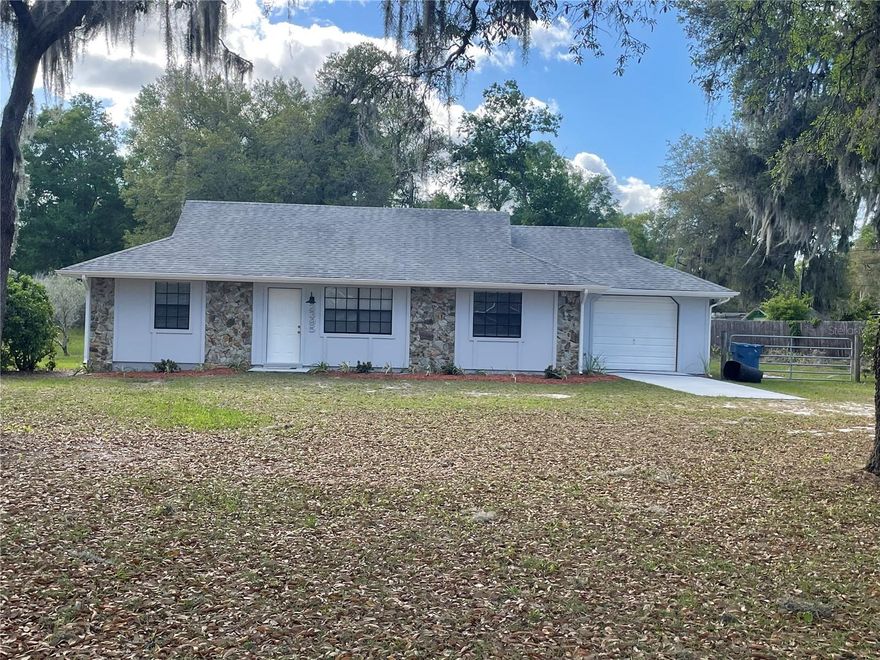 Located in the desirable Tomoka Woods area of North DeLand, this charming 3-bedroom, 2-bathroom home sits on a spacious 0.6-acre lot and offers convenient access to Historic Downtown DeLand, I-4, Daytona Beach, and Ormond Beach. Enjoy nearby outdoor recreation with the public boat ramp at beautiful Lake Dias just approximately one mile away. This property provides ample space to accommodate your RV, boat, and other recreational equipment. Inside, the home features two separate living areas, including a bright and inviting space filled with natural light and highlighted by a cozy wood-burning fireplace. The generously sized kitchen comes fully equipped with appliances, offering both functionality and convenience. Recent updates enhance the home’s appeal, including a brand-new water heater, new luxury vinyl flooring, new carpeting throughout, updated kitchen cabinets and countertops, and new appliances including a dishwasher, range, and range hood. The roof was replaced in 2018, contributing to the home’s overall value and peace of mind. With no HOA restrictions, this property presents an excellent opportunity to personalize and create the home that suits your lifestyle. Don’t miss this opportunity—schedule your private showing today and envision your future home!