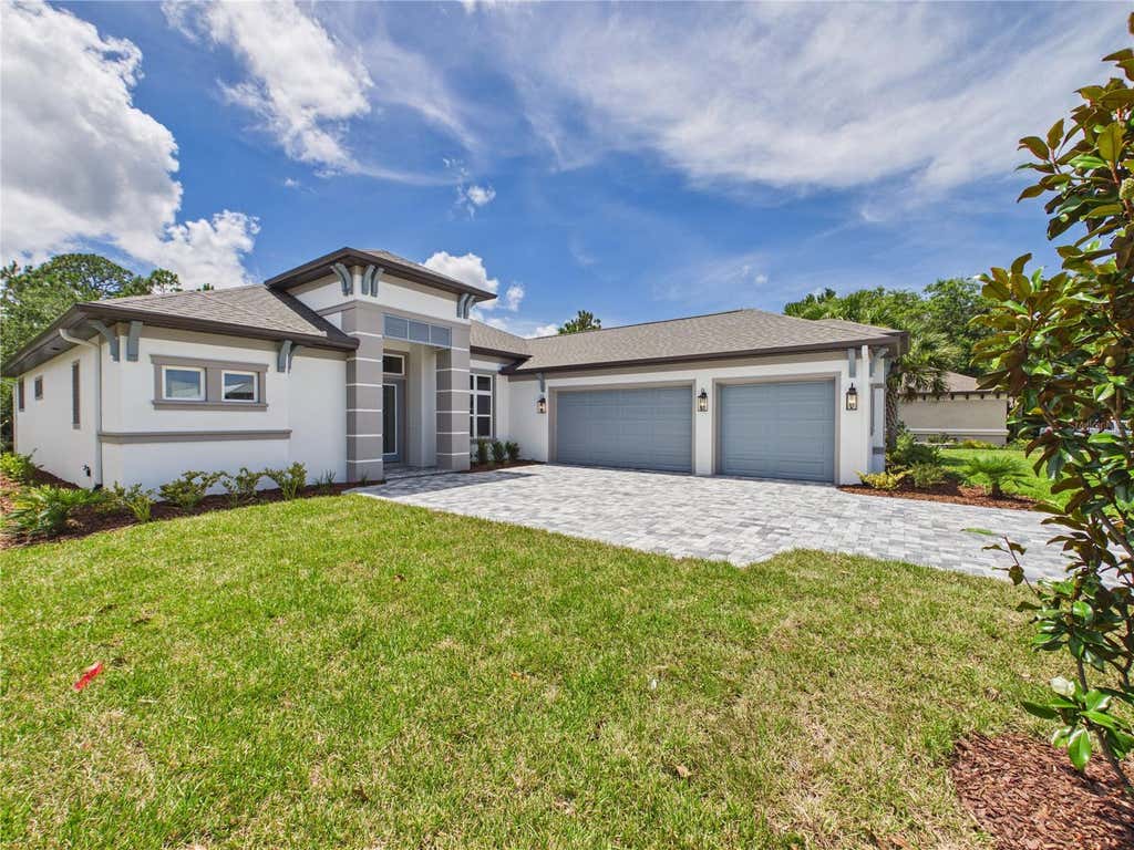 Photo of 230 S Riverwalk Drive, Palm Coast, FL 32137 (MLS # FC319416)
