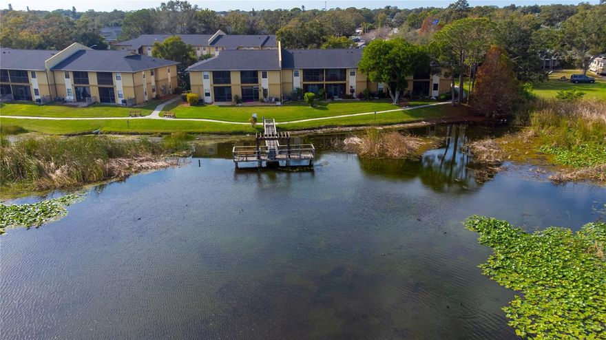 Fall in love with this first floor, lakefront 3 bedroom, 2 bath condo in the gated community of Bella Vista. Features an open concept floor plan with the kitchen overlooking the large living room where the sliding glass doors lead you to a private, screened patio with direct views of scenic Lake Seminole. Kitchen features granite counter tops, newer stainless steel appliances plus oak cabinets. Tile and laminate floors throughout. The washer/dryer are conveniently located inside the unit. The condo also comes with a covered parking space near the entrance along with an additional permitted spot. Residents enjoy exceptional amenities in both the North & South Bella Vista communities, including direct lake access, kayak storage, two clubhouses, two heated pools, two hot tubs, fitness rooms, grilling areas, fishing dock, walking paths and more. Centrally located in Pinellas County, Bella Vista offers easy access to area beaches, shopping, dining, Largo & Seminole Malls, medical facilities, major airports & main thoroughfares to Tampa and St. Petersburg. This is a great investment opportunity with immediate leasing allowed. Or make it your primary or secondary/seasonal residence. All-ages community and pet friendly too! (Up to two pets.)  List of Owners updates available upon request. Roof 2023, A/C 2024, Water heater 2024. Call today for your private tour.