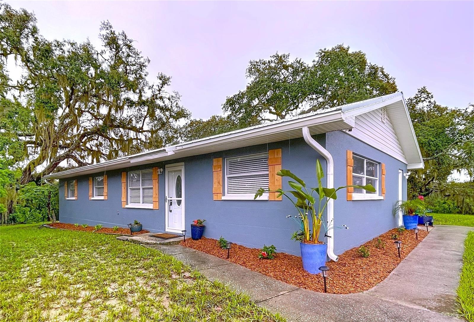 Welcome to your beautifully updated home on a newly re-platted 2.3-acre parcel in Spring Hill! This property has been thoughtfully refreshed inside and out. Enjoy peace of mind with a new roof on both the home and shed, plus a new well pressure tank. The interior features all new flooring, a fully renovated owner’s bath with tile, dual shower fixtures, vanity, and mirrored cabinet, as well as fresh interior and exterior paint. The kitchen shines with new appliances, while the laundry room now includes new cabinetry for ample storage. Additional upgrades include new shutters, new front storm glass/screen door, keyless entry, new side doorknobs, and new door hardware throughout. Lighting has been modernized with new fixtures and recessed lighting. Outside, a new driveway is being installed on the north side with added parking plus a 30 AMP hookup at the shed for a camper or RV.