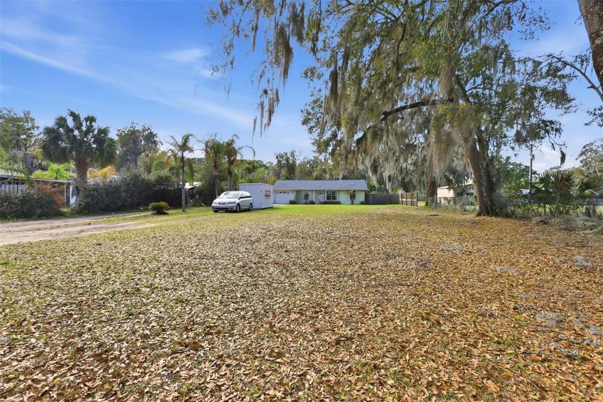Florida Living, Fully Upgraded & Move-In Ready — Oversized Lot, Fruit Trees & Room for All Your Toys!

Welcome to one of DeLand's most charming and thoughtfully upgraded homes — tucked on a quiet street just off Lake Winnemissett Drive, with I-4 access less than 2 miles away via SR-44. You're just 35 minutes to Daytona Beach, 30 minutes to New Smyrna Beach, 45 minutes to Orlando's world-class theme parks, and a short drive to natural gems like Blue Spring State Park and Hontoon Island. The best of Central Florida is right at your doorstep.

Set on an expansive ~half-acre lot, this 3-bedroom, 2-bath beauty has been loaded with recent upgrades and is ready for its next chapter. A brand-new roof (2022), freshly installed tile flooring throughout, freshly painted interiors, and stunning master bath renovation mean the big-ticket items are already done — just move in and enjoy.

Step through the covered front porch and into a bright, open living space where updated tile floors flow seamlessly through the kitchen/family room combo. The kitchen shines with white cabinetry, stainless steel appliances, and a pass-through to the dining area — perfect for entertaining. The vaulted-ceiling dining room is airy and versatile, ideal as a formal dining room, home office, or flex space.

The renovated master bath is a showstopper — fully tiled walk-in shower with designer subway tile, mosaic pebble floor, and sleek matte black fixtures. A second updated bath rounds out the interior with clean, coastal-inspired finishes.

Outside is where this property truly sets itself apart. The fully fenced backyard features a pergola with string lights, a paved patio, mature fruit trees, lush lawn, storage sheds, and plenty of room for your boat, RV, or recreational vehicles - no HOA restrictions here. 
Majestic Spanish moss–draped oaks frame the property in classic Central Florida style, delivering standout curb appeal from the moment you arrive.

Bonus perks you won't find everywhere:
- Nearby lake with fishing & boating access available via separate membership (not included)
- One-car garage
- Walking trails within the neighborhood
- Fruit tree on the property
- Pergola with string lights — ready for outdoor entertaining

This is the DeLand lifestyle buyers dream about — close to everything, private, upgraded, and priced to move. Homes like this don't last. Schedule your private showing today before someone else calls it home.**

 Buyer to verify all information.*