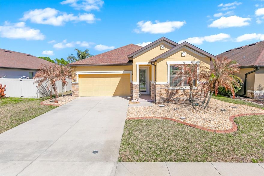 One or more photo(s) has been virtually staged. Beautiful lakefront home in the highly desirable Tuscany Woods community! This popular neighborhood offers a superb lifestyle with a private pool, clubhouse, playground, and sidewalks throughout, all just minutes from shopping, dining, entertainment, and world-famous Daytona Beach. Meticulously maintained and move-in ready, this 2014-built residence features a new roof (2018) and fresh exterior paint (December 2025).  Step onto the covered front porch and enter through a decorative storm door into a grand foyer that welcomes you into this elegant home. The spacious 3-bedroom, 2-bathroom floor plan is bright and open, with 1,675 sq. ft. of air-conditioned living space and a screened Florida room overlooking serene lake views. Porcelain tile flows through the living areas, while plush carpet adorns the bedrooms for comfort.  The impressive great room blends effortlessly with the dining area and fully-equipped kitchen, making it ideal for both everyday living and refined entertaining. The kitchen features rich wood cabinetry, gorgeous granite countertops, stainless steel appliances, a large pantry, and a center island with bar seating.  The luxurious primary suite offers privacy and comfort, complete with an alcove entry, large walk-in closet, private bathroom with dual sinks, granite vanity, step-in shower, and a newer walk-in therapeutic jetted bathtub. On the opposite side of the home, two guest bedrooms share a conveniently located full bathroom.  Additional highlights include an indoor laundry room with washer and dryer included, a spacious two-car garage, and a whole-home water softening system and security system for added comfort and convenience. The manicured lawn is maintained with an in-ground sprinkler system, enhancing curb appeal.  All existing furnishings convey upon request. Tuscany Woods offers a superb location with easy access to I-95, I-4, Daytona Beach International Airport, Tanger Outlets, Robert Strickland Park, hospitals, and excellent schools, making this home the perfect combination of style, convenience, and lifestyle.