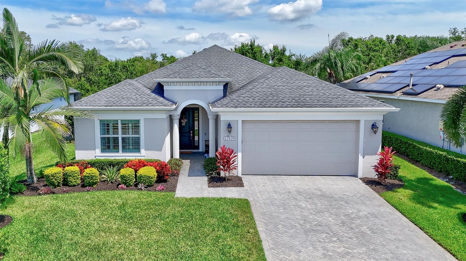 Welcome to this beautifully designed 2-bedroom, 2-bath plus den home in the sought-after, gated community of GreyHawk Landing! Featuring over 1,800 square feet of thoughtfully planned living space, this layout includes a spacious great room, open kitchen with oversized island, and a separate dining nook—perfect for entertaining or everyday living. The versatile den with a closet can easily be converted into a third bedroom if needed.
The owner’s suite is a private retreat with a large walk-in closet and spa-like bath, while the split floor plan offers privacy for guests in the second bedroom. Step outside to your extended covered lanai—ideal for relaxing or dining al fresco—with options for a summer kitchen to elevate your outdoor living experience.
GreyHawk Landing offers an incredible lifestyle with 24-hour guarded gates, miles of scenic walking and biking trails, two resort-style pools with a waterslide and splash pad, playgrounds, lighted tennis and Pickleball courts, fitness center, soccer and baseball fields, a fishing pier, and stocked bass ponds. Just minutes from Lakewood Ranch, Waterside Place, premier shopping and dining, and a short drive to the Gulf beaches—this location truly has it all.
Whether you’re looking for a full-time residence or a Florida retreat, this home checks all the boxes!