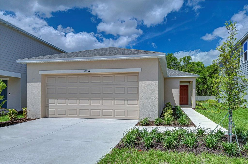 Photo of 13341 Tropical Breeze Way, Hudson, FL 34669 (MLS # TB8445375)