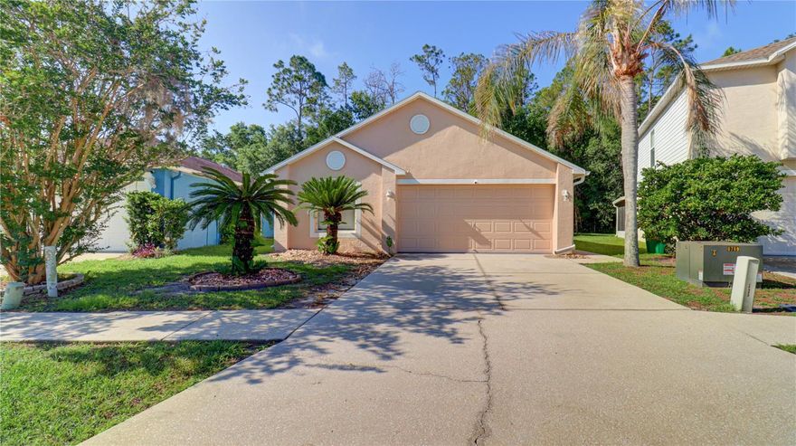 Welcome home to this beautifully updated, MOVE-IN READY 3-bedroom, 2-bath home located in the Pine Ridge community of Wesley Chapel — featuring NO CDD fees and a LOW HOA! Perfectly priced and thoughtfully upgraded, this home offers peace of mind with major improvements already completed, including a NEW 2024 roof, 2024 HVAC system, and 2024 water heater. Inside, you’ll find ceramic wood-look tile flooring throughout, soaring ceilings, and an open-concept layout ideal for everyday living and entertaining. The fully remodeled kitchen is a standout feature, showcasing granite countertops, soft-close cabinetry, a custom pantry system, stainless steel appliances, and upgraded lighting/ceiling fans throughout the home. Additional upgrades include a custom primary closet system, new sliding glass doors with built-in blinds, and a reinforced 400-lb hurricane proof garage door. The home also includes a newer washer and dryer plus an additional refrigerator in the garage. The spacious kitchen overlooks the great room and opens directly to the covered and screened lanai, creating seamless indoor-outdoor living. Enjoy relaxing backyard views with NO rear neighbors and a peaceful tree-lined backdrop. The private primary suite features a large walk-in closet, separate vanity area, and private water closet. Bedrooms 2 and 3 are situated on the opposite side of the home, sharing a full hall bath and linen closet — offering an ideal split-bedroom floor plan for privacy and guests. Conveniently located just 3 miles from I-75, this home is close to top-rated schools, shopping, dining, medical facilities, and Wesley Chapel District Park. Don’t miss your opportunity to own this beautifully updated home in one of Wesley Chapel’s most convenient locations. Schedule your private showing today!