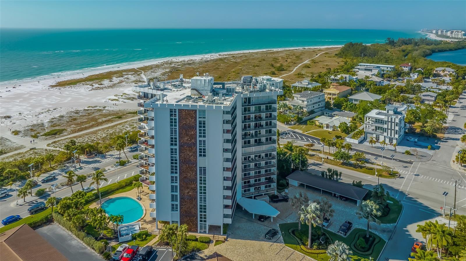 This is your opportunity to own in one of the most desirable locations on Lido Key! Enjoy the St Armands lifestyle in this east facing, 7th floor condo with spectacular views of Sarasota Bay, Pansy Bayou, and the downtown Sarasota cityscape from every room. Situated directly across from Lido Beach and just one block from St Armands Circle’s numerous boutiques and restaurants, St Armands Towers North is a landmark on Lido Key. Relax in tropical breezes on the expansive 40-foot-long private balcony, while you gaze at passersby meandering on the Circle, or marvel at the sparkling city lights in the evening. This comfortable 2-bedroom, 2-bath condo has been lovingly maintained and features sliding doors that lead from the living room and both bedrooms to the balcony, bringing the outdoors in and adding light throughout the space. The spacious Primary Bedroom includes an ensuite bathroom and walk-in closet, and the additional bedroom with built-ins (which include two twin beds) is perfect for a home office, or guest room. One covered carport is included, with a private storage closet. Washer-dryer in unit. This well managed community has amenities that include a heated pool with Gulf Views, exercise facility, private storage closet, community/party room/library, onsite Maintenance Supervisor, and a full-time office manager. Enjoy island living in the heart of Lido Key, with easy access to all that Sarasota has to offer!