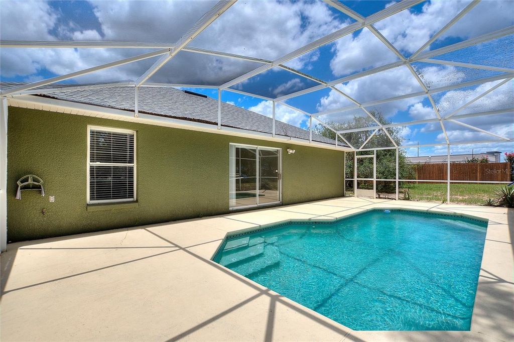 Photo of 128 Burgoyne Loop, Davenport, FL 33897 (MLS # O6414549)