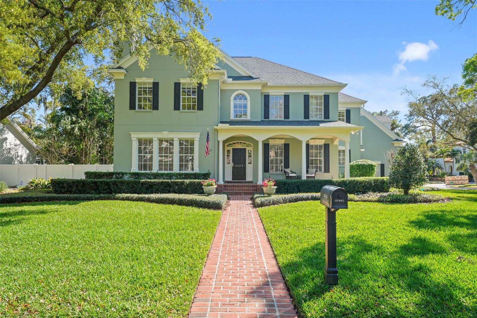 Welcome home to this stunning five-bedroom, five-bathroom Sample Properties custom-built home and personal residence of the owner, John Sample. This meticulously maintained home offers 4514 square feet of beautifully designed living space. Located on a charming corner lot on Sevilla Street, the home is surrounded by majestic oak trees and just off Sierra Circle Park. As you arrive, a brick walkway leads to a cozy covered porch, perfect for relaxing with a beverage. Inside, you'll find timeless custom three-piece crown molding, oak hardwood floors, and high ceilings throughout. The formal living room features a brick fireplace flanked by reading nooks with storage. The impressive kitchen boasts an oversized island with a gas cooktop, ample storage, a large dry bar, and a walk-in pantry. The adjoining dining area accommodates large gatherings, flowing seamlessly into the family room with built-in bookshelves and French doors leading to the backyard oasis. Step outside to enjoy a heated pool and spa, an oversized brick back porch with ceiling fans, an outdoor shower, and a gas grill. Upstairs, the primary suite features a tray ceiling and a large walk-in closet, with a luxurious bathroom offering a double vanity and a large jacuzzi/spa tub. Two additional bedrooms share a Jack and Jill bathroom, while a fourth has an ensuite bathroom. Above the three-car garage, a bonus room and guest suite await. Located in a quiet part of South Tampa, this home offers luxury and convenience and is easily accessible to Hyde Park, Tampa International Airport, and downtown. Welcome home!