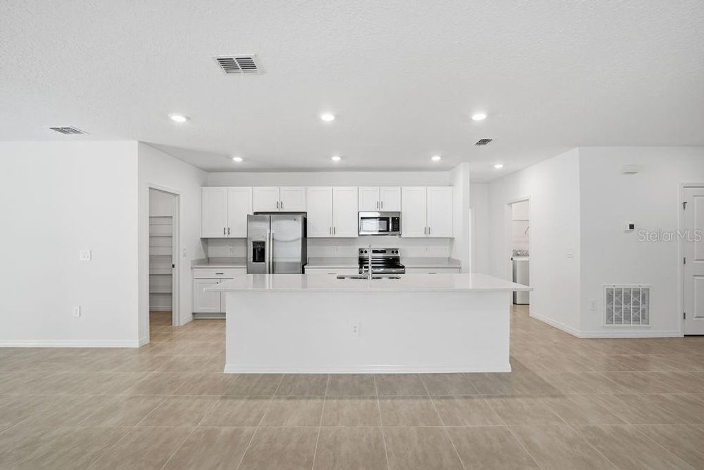 Photo of 13520 Tropical Breeze Way, Hudson, FL 34669 (MLS # TB8444588)