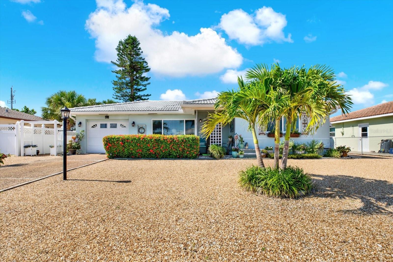 Just Steps from the Sand – Remediated & Move-In Ready Beachside Gem! Welcome to 204 45th Ave in beautiful St. Pete Beach – a charming, fully remediated home just a few minutes' walk to the Gulf! Recently updated and permitted by licensed, insured contractors after last year’s storms, this 2-bedroom, 1-bath coastal retreat offers peace of mind, modern comforts, and an unbeatable location. Inside, you’ll find fresh neutral tones, all-new carpet, updated ceiling fans, and sleek light fixtures. The kitchen is designed for function and style with tall cabinetry, replaced lower cabinets, and newer appliances – including a washer and dryer that convey- along with stunning butcher block countertops. The converted Florida room adds flexible living space and features brand-new 2024 windows and its own wall A/C unit for year-round comfort. Step outside to enjoy the covered patio, xeriscaped yard, an outdoor shower, and ample parking in the driveway – all just moments from world-famous beaches, parks, top restaurants, shopping, and major routes. Bonus features include a whole-home generator, tile roof with approx. 15 years of life, extra garage storage with a loft, and a strong-running main A/C system (inspected post-storm). Whether you’re looking for a beach getaway or a full-time home, this move-in-ready property offers the best of St. Pete Beach living!