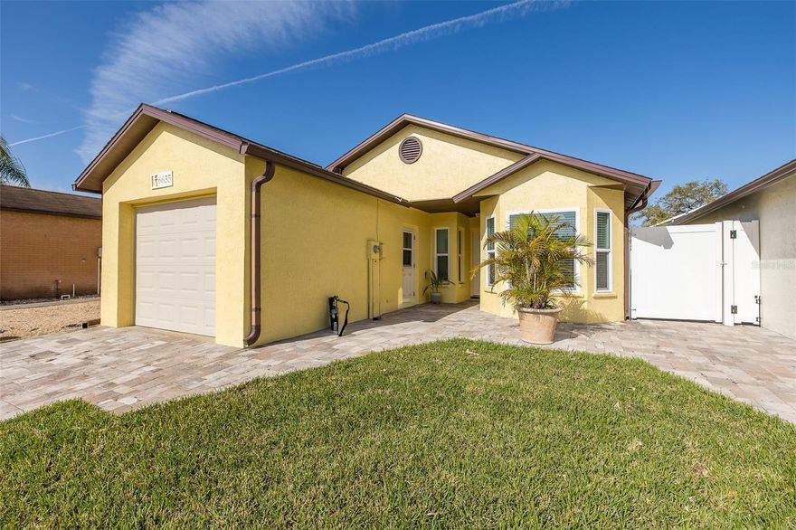 Welcome to 6635 Crossbow Lane in New Port Richey. This updated, move-in ready home offers 2 bedrooms, 2 bathrooms, a 1-car garage, and an enclosed back porch that can easily serve as a home office or flexible living space. Inside, you’ll find a bright open floor plan with a split-bedroom layout. The eat-in kitchen features wood cabinetry, bay windows, newer appliances, and a pass-through breakfast bar to the dining area. The living room is enhanced with French doors with inserted mini blinds, creating a seamless flow of natural light. The primary suite includes a walk-in closet, and additional interior features include newer carpet, inside laundry with washer and dryer, and updated entry and rear doors. Major improvements include a 2021 roof, all doors replaced in 2021, 2020 windows, a vinyl privacy fence installed in 2024, and new sod in 2026. Additional highlights include rain gutters and decorative pavers for the driveway, front entry and side of the home. Best of all, no flood insurance is required, and there is no HOA or CDD fees. Located within the city limits of New Port Richey, this home is centrally positioned near major highways, shopping, hospitals, medical offices, schools, and beautiful Gulf Coast beaches. Enjoy a golf cart-friendly lifestyle with easy access to downtown New Port Richey, offering restaurants, taverns, festivals, shopping, and professional services. Nearby attractions include Sims Park, Cotee River Park, the New Port Richey Recreation & Aquatic Center, a public boat launch with direct Gulf access, and Robert K. Rees Memorial Park just a short drive away.