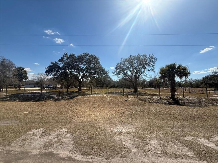 Build your dream home or invest in your future with this beautiful 1.25-acre surveyed vacant lot in the desirable Viking Estates / Prairie area. Not too far off the paved Road. This high and dry property (Flood Zone X) offers privacy with convenient access. The lot features beautiful mature trees, is cleared and fully fenced, and is ready to build. No flood zone, providing peace of mind and flexibility. Ideal for a single-family home, manufactured home, private homestead, small ranch, weekend retreat, or investment property. Enjoy rural living while remaining within driving distance to downtown Okeechobee, shopping, schools, and Lake Okeechobee, famous for boating and world-class bass fishing. The area continues to grow, making this an excellent opportunity to secure affordable land in a promising location.