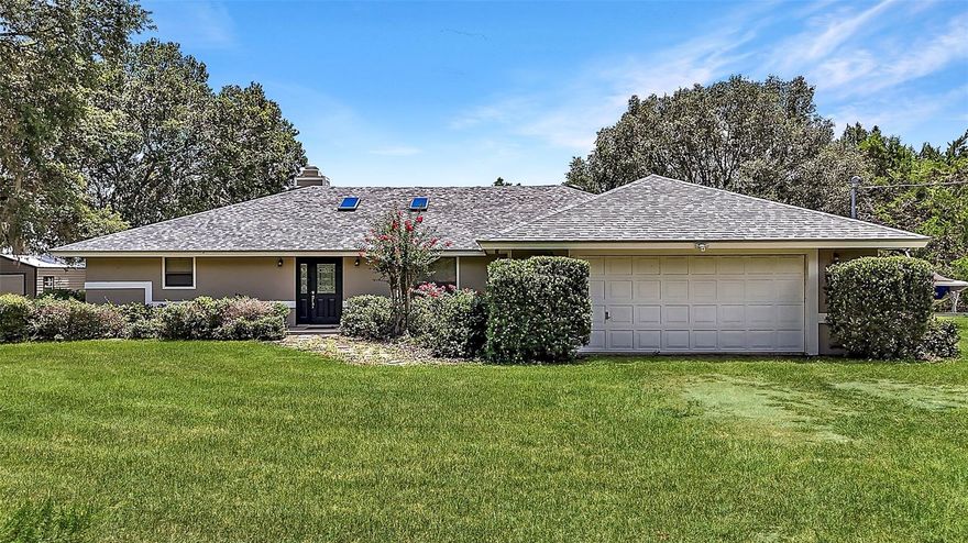 Tranquil 6-Acre Pool Home in Umatilla, FL – Just Minutes from The Villages with a Brand New Roof!

Tucked beneath a canopy of majestic Grandaddy oaks, this stunning 3-bedroom, 3-bathroom pool home sits on 6 beautifully maintained acres in the heart of Umatilla. Offering over 2,400 square feet of living space and 4,376 total square feet under roof, this property delivers the perfect blend of peaceful, private country living and convenient access to nearby amenities—just 13 miles to The Villages, 18 miles to downtown Mount Dora, and only 8 miles to Umatilla’s shops, schools, and restaurants.

The setting here is truly special. From the moment you step outside, you’ll feel immersed in nature. Enjoy your mornings by the screened-in gunite pool, where breathtaking sunsets light up the conservation views behind the home. A canal at the rear leads to a large lake, perfect for bass fishing or simply enjoying the serene water. Wildlife is a daily delight—deer, turkeys, and birds frequent the property, adding to its tranquil, Old Florida charm. There’s even a firepit for cozy evenings under the stars and plenty of space to build a workshop, RV pad, or carport thanks to agricultural zoning and no deed restrictions.

Inside, the home has been tastefully updated while maintaining its warm, country-inspired feel. The open-concept floor plan seamlessly connects the main living areas, anchored by a floor-to-ceiling cobblestone wood burning fireplace and built-in shelving. Two sets of French doors open to the screened pool area, offering effortless indoor-outdoor living. New ceiling fans and updated lighting throughout the home bring a fresh, modern touch.

The expansive farmhouse-style kitchen is a standout, featuring stainless steel appliances, granite countertops, under-cabinet and recessed lighting, a large farmhouse sink with views of the pool and backyard, and ample white cabinetry for storage. A spacious 10x7 butler’s pantry provides even more prep and storage space, complete with its own sink, fridge, and granite counters—ideal for entertaining.

The generously sized master suite is a peaceful retreat with his-and-hers closets, French doors to the pool area, and a private bathroom with dual sinks and a walk-in tiled shower. Two guest bedrooms, each with large closets, provide comfortable accommodations for family or visitors, while the inside laundry room with utility sink adds everyday convenience.

The exterior features are just as impressive. The oversized two-car garage and large storage shed offer plenty of space for equipment and hobbies. Manicured landscaping surrounds the home, and there’s still room to bring animals, add gardens, or customize the land to suit your lifestyle.

Whether you're an outdoor enthusiast, an equestrian looking for space, or simply someone dreaming of a quiet life surrounded by nature, this Umatilla property delivers. You’re just 25 miles to the Ocala National Forest, 19 minutes to Alexander Springs for summertime swimming, and not far from trail systems like Santos, Pruitt, and Landbridge for hiking, biking, or riding.

If you’re seeking space, privacy, and convenience—this is the kind of property that rarely comes available. Schedule your tour today!