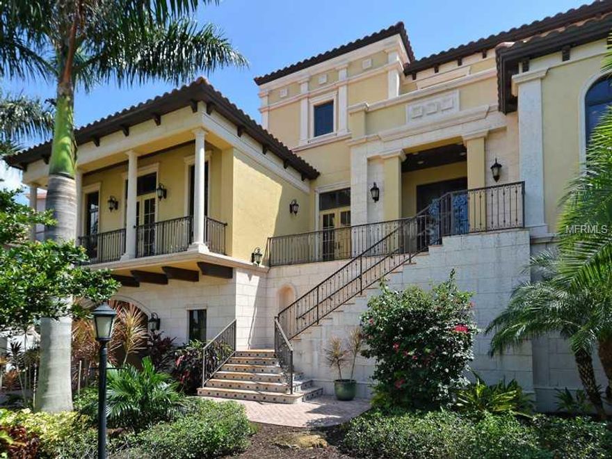 The day begins with a cup of coffee over a scene of tranquility. Three levels of balconies, terraces and lanais look out to the mangroves, Sarasota Bay and Longboat Key. This Mediterranean home, designed by Palm Beach and Naples architect Stofft Cooney, is rich in quality and architectural details. Its  6,538 square feet under air includes four bedrooms, four full baths, two half baths, family room, separate living room, wine cellar, dining room, office, butlers' pantry and a robust kitchen. Each room has a personality accenting the design inspiration. The bedrooms are en suite, each bath a work of art. The scale of the home is inviting. The ceilings give gracious volume, and the floor plan is both social and private. The master suite opens to a view from Downtown Sarasota to North Longboat Key, enjoyed on the large private balcony. The bath is sumptuous with vaulted ceilings, slipper tub, separate water closets, tumbled marble tiled shower and massive closets. Main floor is a feast for the eyes with water views, marble and wood floors, grand open kitchen with Wolf and Bosch appliances, dining room with hand-painted barrel ceilings, living room with fireplace and billiards room with bar. The lanai hosts an outdoor kitchen with Wolf grill, fireplace and salon off the great room overlooking Sarasota Bay and the lower level pool and terrace. A busy day of sports, cultural or beach activities brings you home to the serenity of Legends Bay and sunset over the Gulf.