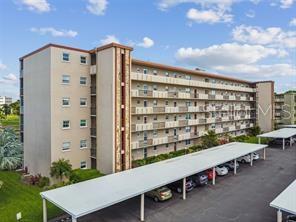 IRONWOOD CONDOS. 55+ (I BLDG.). First floor End unit allows for plenty of privacy and walk right-in from parking lot. Beautifully maintained 2BR/2BA/Screened & Glass Enclosed Lanai/Sun Room. Enjoy relaxing on your Lanai year around, while watching the golfers, birds around the lake and the wonderful Florida weather. Remodeled Eat-In kitchen with wood cabinets, Corian counter tops, updated appliances and pass-thru to Dining Room. Spacious Great Room looks out to Lanai/Sun Room, which has built-in shelving. Split Bedrooms. Master Bedroom with a door you can close off for privacy has an ensuite bathroom with walk-in shower, walk-in closet and extra closet nearby. Guest Bedroom, with guest bathroom beside it that has tub/shower combo, is located for easy access from living room, kitchen, etc. Washer/Dryers are located in laundry room in the center of the bldg. near the elevator. Carport #31 in front of bldg. "I". Roof has been replaced, walkways resurfaced, plumbing stacks replaced, and carport roofs replaced. Bldg. is located on the golf course and right next door to the Clubhouse and pool. Clubhouse has scheduled activities, library, kitchen, meeting/party rooms, billiards, banquet room, fitness, grilling area, and a heated pool with large deck. On site amenities include shuffleboard, tennis Court, walking/running/stroll around the community and meet some greet neighbors. Centrally located to banks, dining, libraries, shopping, worship, medical, Sarasota-Bradenton Airport, downtown Bradenton Riverwalk, and several award winning beaches. Just a short drive across the famous Skyway bridge to St. Pete, Tampa and points beyond. Don't let this one slip by you!