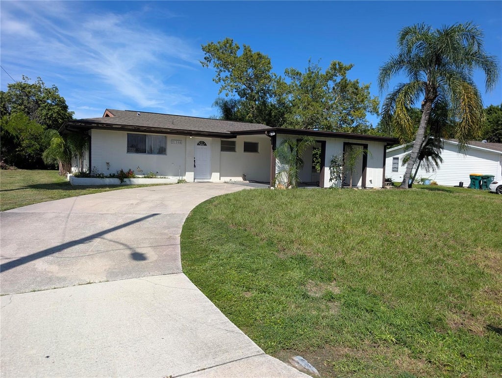 Photo of 21358 Burkhart Drive, Port Charlotte, FL 33952 (MLS # O6446796)