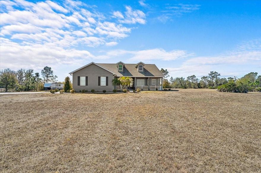 LIVE OFF THE LAND! Grow your own vegetables, bring your animals, and embrace the peaceful rhythm of country living — all while being just 15 minutes from shopping and dining.

This impeccably maintained 3-bedroom, 3-bath residence offers a thoughtful and versatile layout, including a dedicated office and an expansive bonus room currently used as a game room. The bonus space presents an excellent opportunity for a private in-law suite, with a full bath conveniently nearby. Two additional bedrooms with walk-in closets and a shared bath are tucked away in their own wing of the home, offering privacy and comfort.

The spacious primary suite easily accommodates a king-size bed with additional furnishings and a sitting area. The luxurious primary bath features separate his-and-her vanities, a private water closet, a garden tub, and a Roman walk-in shower.

Designed with impressive volume and natural light, the great room and kitchen boast soaring 12-foot ceilings, while the remaining rooms feature 10-foot ceilings throughout. The kitchen offers abundant cabinetry, a large double-door pantry, a formal dining room, and additional casual dining space.

The oversized laundry room is exceptionally functional, complete with a built-in vanity and sink, extensive cabinetry, folding counter space, hanging area, and built-in hampers. The 2.5-car garage includes 9-foot built-in storage closets, and a 50-amp generator connector adds convenience and peace of mind.

The salt water pool is long enough to actually swim laps. Enjoy entertaining under two spacious covered seating areas.

Outdoors, you’ll find a 12x30 workshop/shed equipped with water and electricity, beautiful pine tongue-and-groove porch ceilings, and a stunning pool area with two expansive covered spaces ideal for outdoor dining and lounging. The paved driveway stretches approximately 300 feet, creating a grand and private entrance.

There is ample space to build a barn, stables, or even a large custom garage for automotive enthusiasts. Located approximately 5 miles from the Bradenton Motorsports Park. 
Bring the whole family and experience this exceptional property for yourself.

Washer and dryer do not convey.