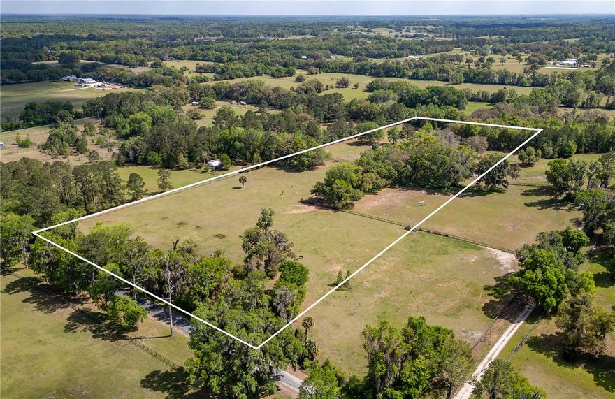Tucked away towards the end of a quiet country road, this 15 +/- acre parcel is the perfect canvas for your dream horse farm. With a gently rolling land, a stunning landscape dotted by mature oaks, and multiple site options that would be ideal for a home or barn, this property offers both beauty and versatility. Perimeter fenced with two established pastures, this property is ready for your horses. The land provides a peaceful backdrop for active equestrians dreaming of developing their farm from the ground up. Whether you're looking to build a custom estate or establish a full equestrian facility, the possibilities are endless. Located between both Ocala and Gainesville, you're just a short drive from premier equestrian venues like the Majestic Oaks, World Equestrian Center, HITS, and Sweet Dixie South– giving you access to top-tier competition, training, and spectating all year long. Additional acreage available. Come experience the tranquility and possibility of this exceptional property!