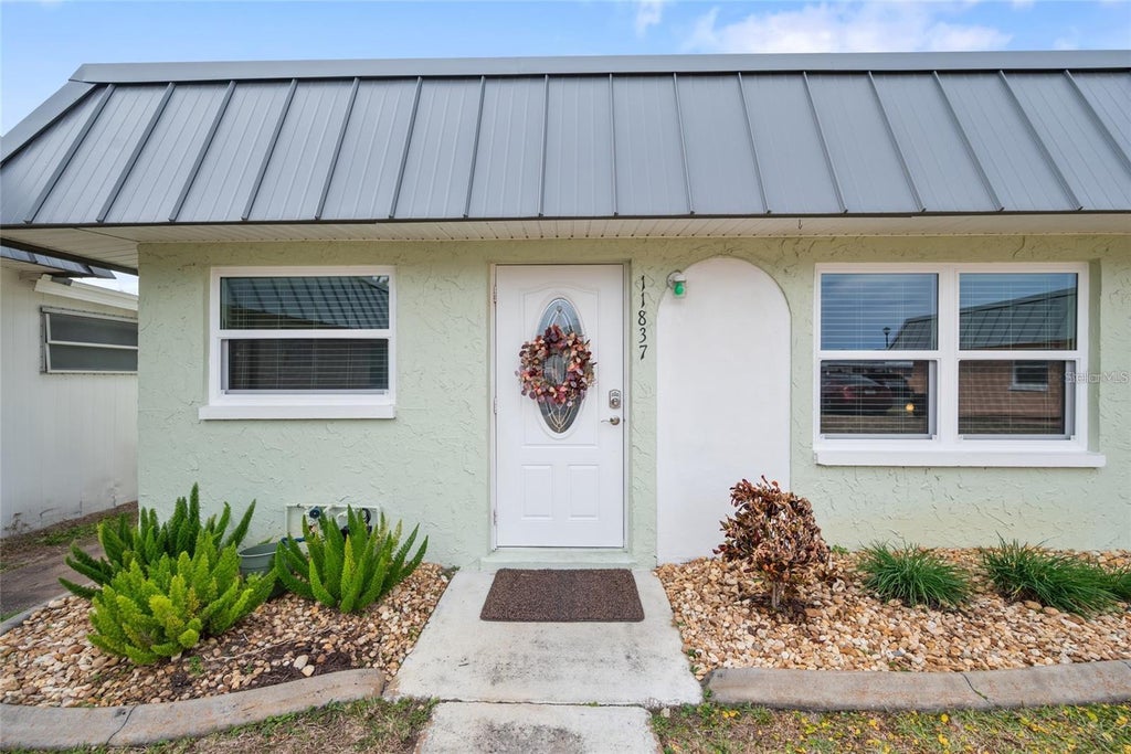 Photo of 11837 Boynton Lane #11837, New Port Richey, FL 34654 (MLS # W7890280)