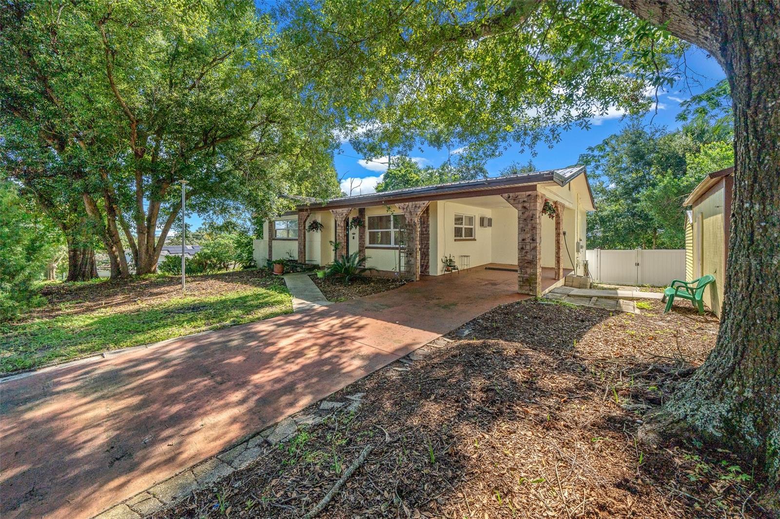 PRICE REDUCTION !!! This charming two-bedroom, two-bathroom house nestled on a larger lot The home offers both comfort and convenience with tile floors in the living areas eat-in kitchen, and a large fenced backyard with mature trees for privacy a detached garage with a workshop a definite must-see.