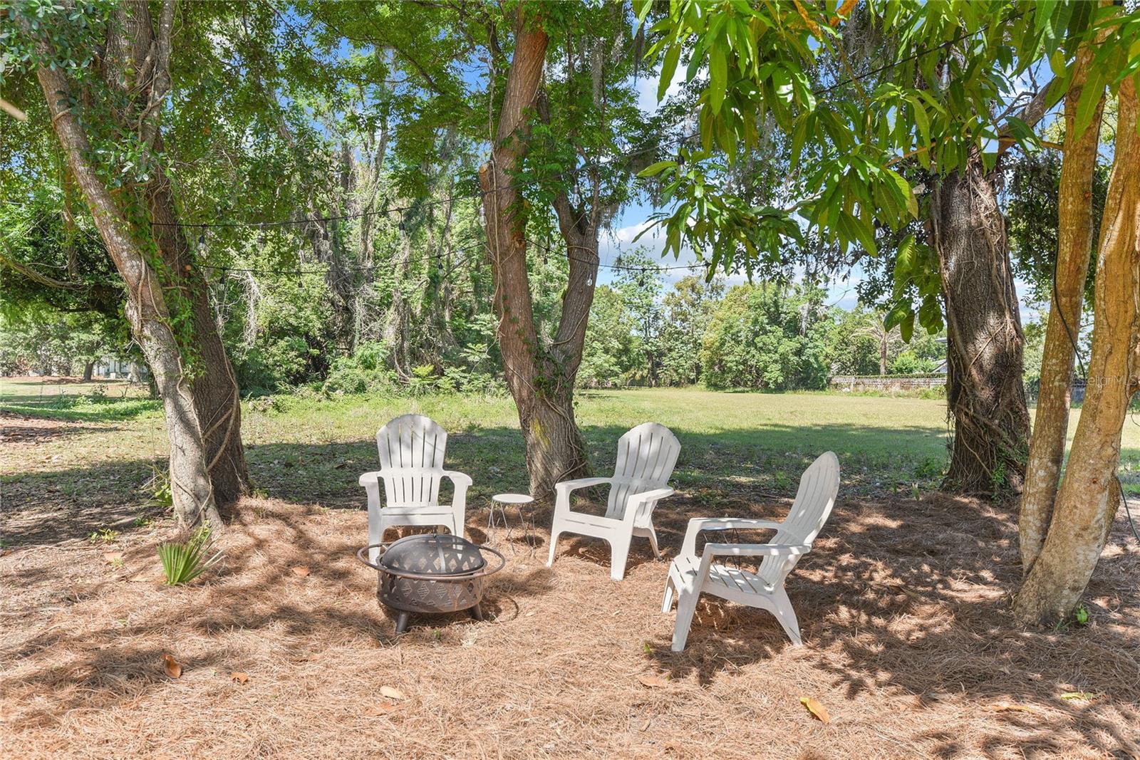 THE best kept secret in WP! 6500sq/ft buildable lot located directly on famed 4th Fairway on WP9 – Winter Park Golf Course! Quiet, private & secluded setting with gorgeous views on dead end street with million $$ neighbors! Walk or bike to Park Avenue, dining and shopping, Rollins College and Winter Park Village. Rent or live in until you expand or build new in the renovated charming bungalow, w/ refinished hardwood floors, brand new kitchen with stainless appliances, 3 generous bedrooms, bonus Florida Room, PLUS single car garage! Cozy firepit seating area with twinkle lights overlooking the golf course. Don’t miss this “one of kind – live your best Winter Park life” opportunity!