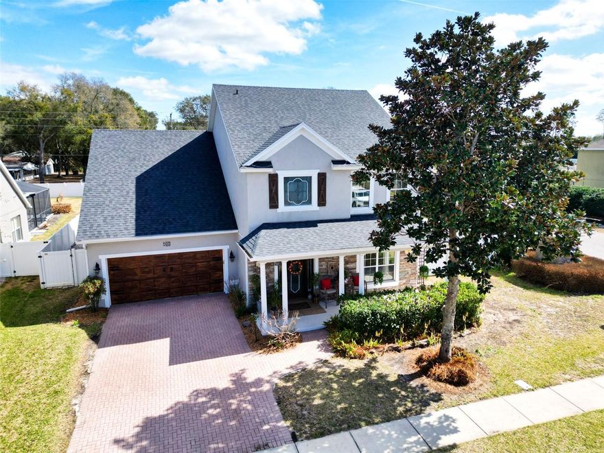 Experience refined living in this beautifully appointed 3,472 sq ft estate nestled on a private .32-acre corner lot with elegant stone elevation and a paved driveway in the highly desirable city of Mount Dora known for its charming, storybook atmosphere and vibrant community events.  From the moment you arrive, this home makes a lasting impression.  Designed with both sophistication and comfort in mind, the thoughtfully crafted floor plan features a first-floor primary retreat, offering privacy and convenience. The spa-inspired ensuite showcases dual marble vanities, dual walk-in closets, a relaxing jacuzzi tub, and a separate walk-in shower; your own personal sanctuary.  The heart of the home is warm and inviting, where the family room with fireplace flows effortlessly into the dining area and upgraded kitchen creating an ideal space for gathering and entertaining. The kitchen is beautifully enhanced with granite countertops, designer backsplash, soft-close cabinetry, pull-out trays, stainless steel appliances, and refined finishes that blend function with style.  Rich architectural details elevate every space, including crown molding throughout, 6-inch baseboards, and upgraded laminate flooring across the entire first level. Natural light fills the home, enhanced by tinted windows for comfort and efficiency.  A versatile flex room provides the perfect home office or creative space, while the formal dining room can easily transform into a playroom or additional lounge. Upstairs, you’ll find three spacious bedrooms, a full bath, and an expansive bonus room overlooking the family room ideal as a media space, gym, study, or future fifth bedroom.  Step outside to your private outdoor retreat. The 16x22 screened-in porch with elegant pavers offers year-round enjoyment, overlooking a fully fenced backyard complete with swing set perfect for entertaining or relaxing evenings at home.  This residence is as efficient as it is beautiful, featuring two AC units with NEST thermostats, a whole-house water filtration system, hybrid water heater, smart locks, Ring doorbell, intercom system, and security system for modern peace of mind.  Recent enhancements include: New Roof (2023), Exterior Paint (2023), Interior Paint (2025), Hybrid Water Heater (2019), Rain Gutters (2019), New Porch (2020), Kitchen Upgrades (2020–2021), First-Floor Flooring (2021).
Beyond the home itself, enjoy the lifestyle that makes Mount Dora so special. Just minutes away, you’ll find shopping and dining at The Fresh Market, family fun and seasonal festivities at Amber Brooke Farms, and the beloved annual blueberry celebrations that draw visitors from all over. Known as an “enchanted” town for its historic downtown, festivals, art scene, and lakeside charm, Mount Dora offers a unique blend of small-town warmth and modern convenience.
Located in a community with low HOA fees, residents also enjoy access to a community pool while maintaining a serene residential atmosphere.  This is more than a home; it’s a lifestyle of elegance, comfort, and timeless Mount Dora charm.