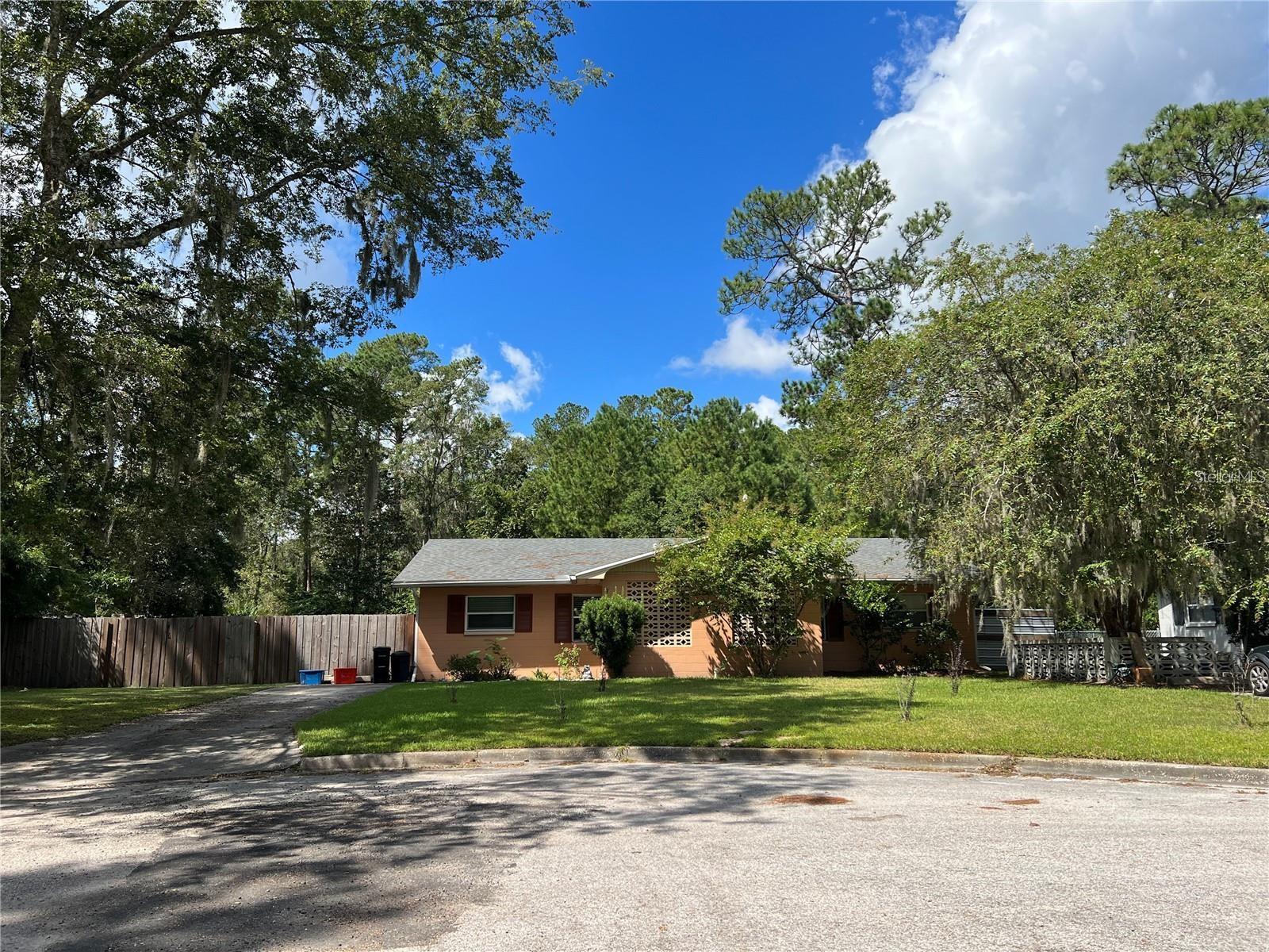 Clean, turn-key 2 bedroom, 1 bathroom in a duplex with fenced yard in NW Gainesville's Chula Vista Park. Available Sept. 29th. Built in 1969, this charming home is on a cul-de-sac and comes with 1 dedicated parking space. Enter off the covered front porch with a mid-century modern concrete screen block wall. The main room is open to the kitchen and the entire unit has tile throughout. Off the kitchen is an indoor laundry room with washer and dryer hookup and access to the fenced rear yard. Pets may be allowed depending on size and breed. The 2 bedrooms share a bathroom. 12 month lease with $54 application fee. Security deposit due upon signing lease. First months rent due upon move-in. Includes lawn maintenance. Less than 4 miles to the University of Florida. 2 miles to Santa Fe College. Walk next door to Las Margaritas or across the street to Magnolia Park with area shops and restaurants. 2 miles to city and state parks and Hunter's Crossing Publix. The current and proposed school zoning is for Glen Springs Elementary, Fort Clark Middle and Buchholz High School.