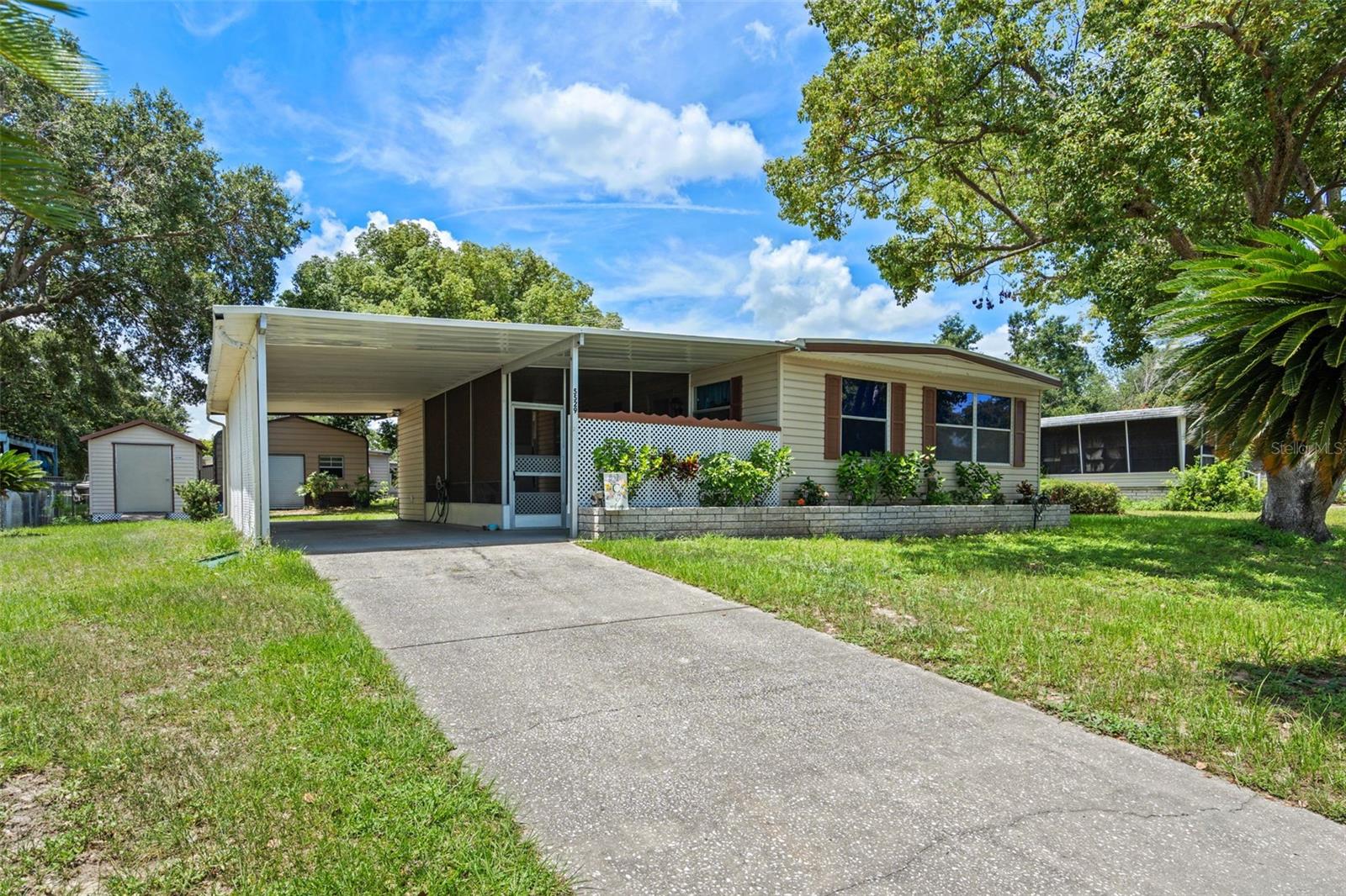 Welcome to this very well-maintained home in the highly sought-after "No HOA" community of Mount Olive Heights! This beautifully updated 2-bedroom, 2-bath manufactured home is designed for modern living and comfort. Step inside to discover stunning luxury vinyl plank flooring, stylishly updated bathrooms, and newer appliances that make everyday life a breeze.
Enjoy year-round comfort with a newer central heating and air conditioning unit, and rest easy knowing your home features a two-year-old roof with a transferable warranty. The screened front porch offers a welcoming, relaxing space, while the expansive backyard, featuring a storage shed and a sturdy steel building, provides endless possibilities for outdoor enjoyment and storage.
Notably, the home’s foundation has been fully updated to current code, backed by an engineer’s foundation certification letter for your peace of mind. Plus, the sellers are generously including a 1-Year AHS warranty to further enhance your confidence in this exceptional property.
Ideally located just three and a half miles from I-4, you'll have easy access to a wealth of shopping outlets, dining options, and world-class medical facilities. With both Tampa and Orlando International Airports nearby, along with Central Florida attractions less than an hour away, this location is unbeatable.
Don’t miss your chance to own this incredible home—schedule your showing today, as properties like this don’t stay on the market for long!