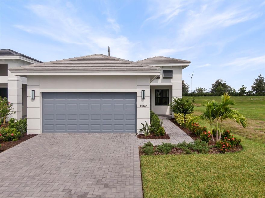This beautifully designed single-story Lido home features 2 bedrooms, 2 bathrooms, and a versatile den. The Lido blends contemporary coastal design with refined finishes and functional living spaces. Its striking exterior façade sets the tone, while a private backyard with a landscaped berm offers a peaceful and secluded outdoor retreat. Inside, the home features thoughtfully curated designer upgrades throughout. The primary suite showcases sleek floating Kitchen Craft cabinetry in the bathroom, creating a modern, spa-like feel. A secondary bath includes a stylish shower conversion, and all showers are finished with tile extending to the ceiling for a clean, elevated look. Luxury vinyl plank flooring flows through the main living areas and den, delivering both durability and coastal-inspired style. The kitchen is beautifully appointed with shaker-inspired Kitchen Craft cabinetry, enhanced by elegant cove crown molding. Cambria Ironsbridge quartz countertops and a designer Emser 3x12 tile backsplash add texture and sophistication. GE stainless steel appliances including a 30” gas free-standing range, dishwasher, and microwave complete this well-equipped and stylish culinary space. Cresswind Lakewood Ranch by Kolter Homes is an exclusive gated community in Lakewood Ranch, Florida, designed for active adults seeking new energy-efficient homes and low-maintenance living. Residents enjoy a pet-friendly environment, scenic walkways, and access to a private lakeside clubhouse with organized activities, flexible event spaces, fitness and yoga studios, and creative art facilities. Outdoor amenities include pickleball, tennis, bocce, resort-style pools, a dog park, food truck court, and social areas. Located in Sarasota/Bradenton, the community offers proximity to beaches, shopping, dining, and cultural attractions, making it an ideal choice for those searching for vibrant, resort-style living on Florida’s Cultural Coast.
