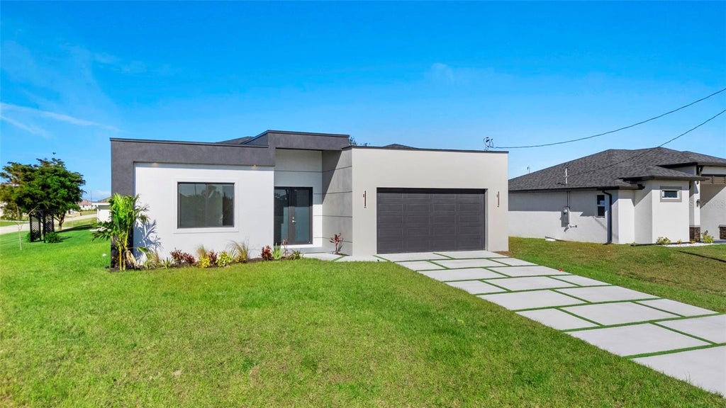 Photo of 2725 Embers Parkway W, Cape Coral, FL 33993 (MLS # O6423151)