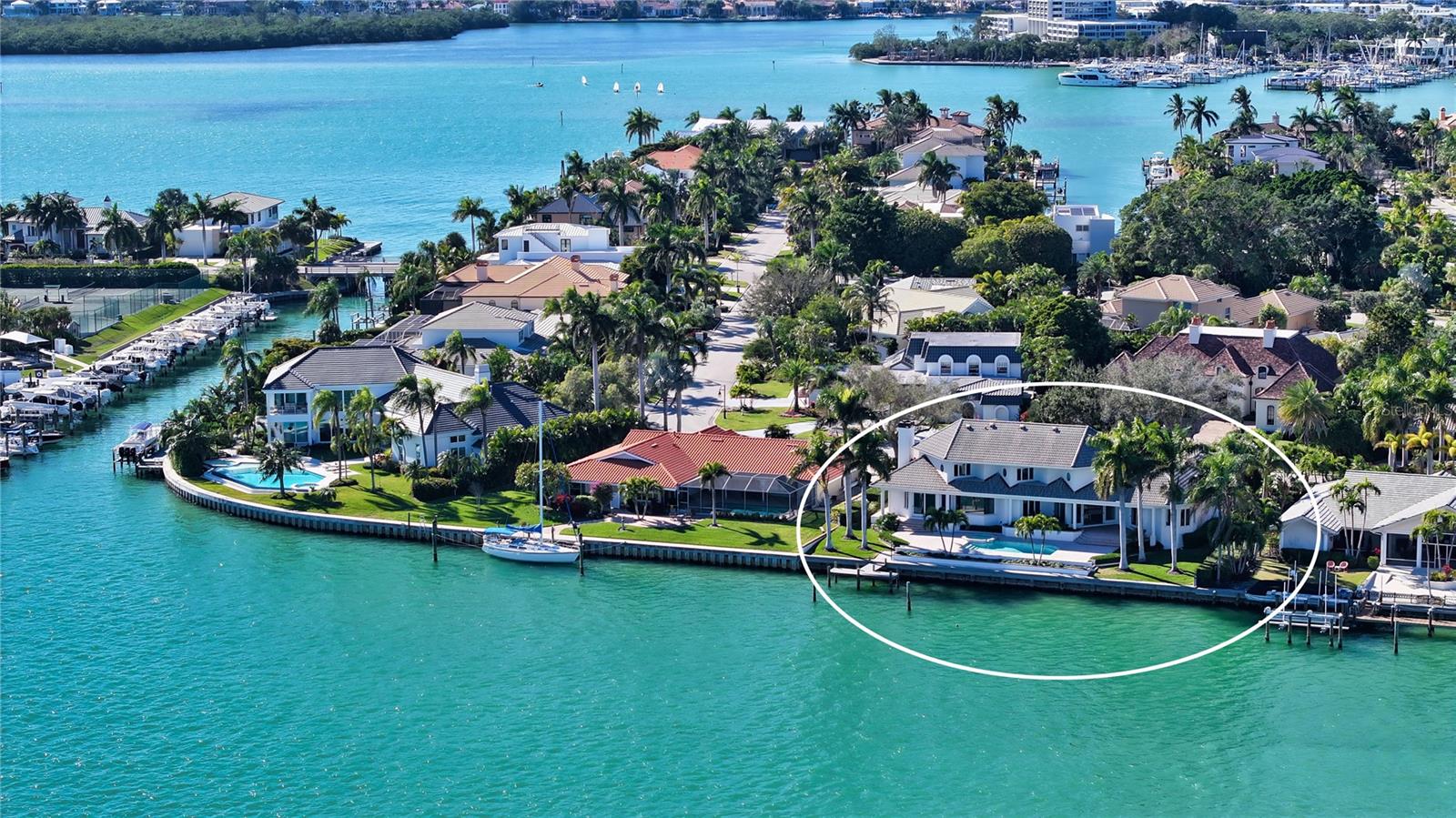 Spectacular bay and downtown views! Nestled directly on Sarasota Bay in the prestigious Bird Key community, this immaculate three-bedroom plus office home is a haven for avid yachtsmen. Offering a multitude of boating options, it boasts an unbeatable location at the junction of Bird Key’s Pompano Pass waterway. With unobstructed access to Sarasota Bay, Big Pass, and the Gulf of Mexico, plus 121 feet of water frontage and a deep-water dock, this residence is a boater's paradise. As you step inside, you'll be greeted by an abundance of natural light, with ceilings soaring to 14 feet and large windows that enhance the sunny ambiance in every corner. The sprawling interior spans over 4,000 square feet across two living levels, providing plenty of room for relaxation and entertainment. This custom-designed home is ready for you to make it your own, boasting crown molding, unique tile flooring throughout, tray ceilings, and walls of glass that open to the breathtaking views of the bay. The layout has been thoughtfully designed for effortless flow from room to room. The formal dining area is just steps from the spacious living room, making entertaining a breeze. The granite kitchen, complete with a breakfast bar, solid-wood cabinetry, and a dining nook, overlooks the family room. Natural light floods in through a wall of sliders that lead out to the pavered pool deck. The primary suite is secluded on the main living level to ensure maximum privacy. This spacious retreat offers direct access to the pool deck, his and her walk-in closets, dressing area, and an expansive en-suite bathroom. On the second floor, you'll discover two additional bedroom suites and a versatile bonus room. Whether you need space for family, guests, or a home office, this home has you covered. Step outside to your very own outdoor oasis. The open sundeck, with its swimming pool, heated spa, and stone steps leading to the waterfront, is the perfect place to relish panoramic bay and city vistas while soaking up the Florida sun and sumptuous bay breezes. Bird Key is the jewel of Sarasota, nestled conveniently between the bustling downtown and the upscale St. Armands Circle. If you're a boating enthusiast, consider joining the Bird Key Yacht Club, where you can indulge in fine dining, private club activities, a fitness center, tennis, swimming, and even a spot to dock your boat. For outdoor lovers, Bird Key Park is just a sun-filled bike ride away from your front door. Bedroom Closet Type: Walk-in Closet (Primary Bedroom).