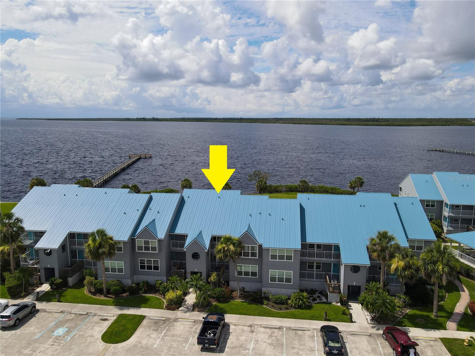 TURN-KEY WATERFRONT 2 Bedroom, 2 Bathroom, SECOND FLOOR Condo with BREATHTAKING water views located in the Harbor Village Community in Port Charlotte. Whether you are looking for a year-round residence, a vacation rental or a winter getaway, this condo is the perfect retreat. Featuring a bright & open floor plan, engineered hardwood flooring throughout, crown molding, plantation shutters, shiplap accent walls, and MUCH MORE! Impress your friends and family with BREATHTAKING water views from the open-concept living and dining area—perfect for entertaining. The kitchen offers ALL stainless steel appliances, granite countertops, tiled backsplash, floating shelves, and lower cabinets for storage, a coffee station, and a breakfast bar. The spacious master suite has a glass door to the lanai showcasing the beautiful view, a dressing vanity, a walk-in closet, and a private bathroom with a single sink vanity and an all-tile walk-in shower with glass sliding doors. The guest bedroom has a built-in closet with a guest bathroom nearby. Sip your morning coffee or unwind with your favorite evening beverage from the lanai, enjoying the water views and incredible Florida sunsets. Harbor Village is a gated community and offers a clubhouse, fitness center, community pool with a large pool deck for nature watching, NEW tennis & pickleball courts, first come - first serve boat docks, boat & RV storage, and a fishing pier. The buildings have recently had new roofs and new siding installed. Conveniently located close to 776 and US-41, providing easy access to shops at Price Crossing, Cocoplum Shopping Center, and the Port Charlotte mall, where you can choose from a variety of restaurants, grocery stores, retail shops, and a short car ride to award-winning beaches, making this an ideal location!! Schedule your showing TODAY!