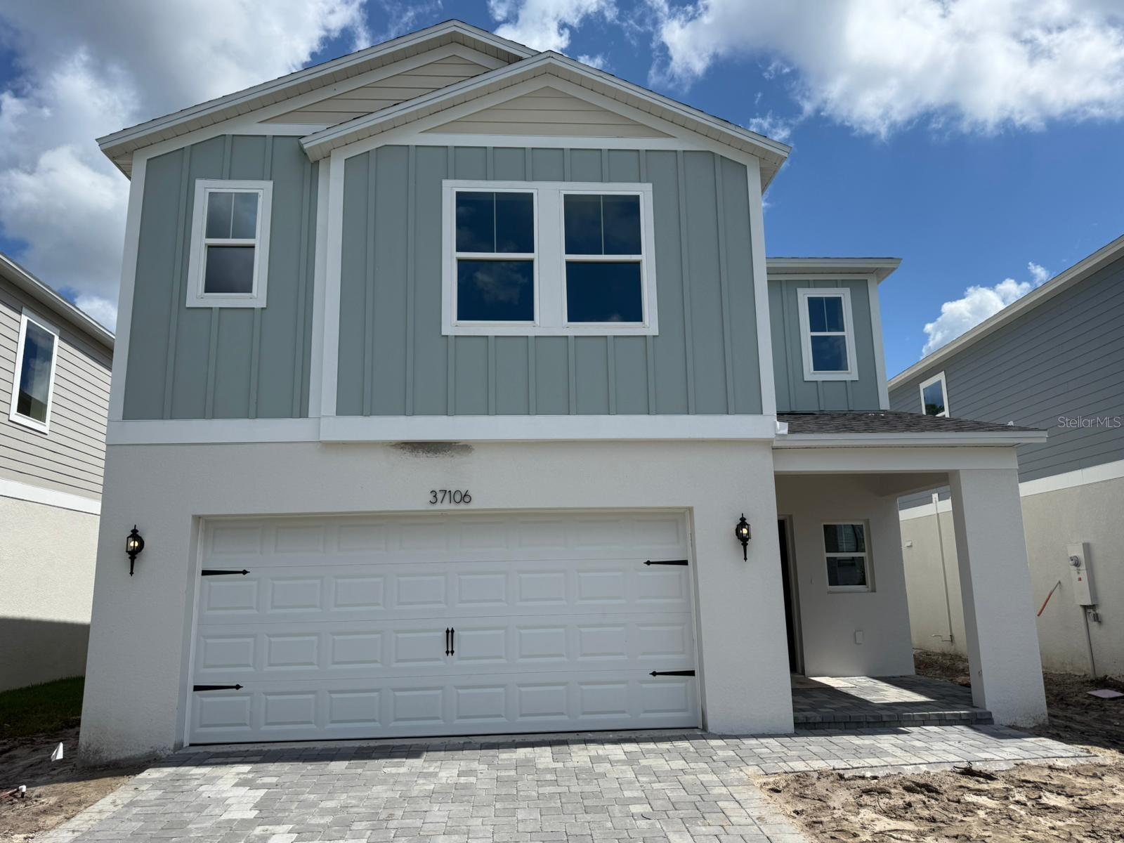 One or more photo(s) has been virtually staged. Under Construction. Brand new Modern 5-Bedroom Home in the Desirable Two Rivers Community Discover this spacious 2420 sq ft, 5-bedroom, 3-bath home, perfectly situated in the sought-after Two Rivers community with gorgeous pond views on a oversized lot. Located just off SR 56 and Morris Bridge Road, this residence offers unparalleled convenience near top-rated schools, shopping, dining, and entertainment options. Interior Highlights: Open-concept main living area flooded with natural light and featuring sleek luxury vinyl plank flooring. Gourmet kitchen equipped with quartz countertops, new stainless steel appliances, and ample cabinet spaceideal for both cooking and entertaining. Private bedroom and full bath off the foyer, providing a quiet retreat for guests or family members. Upstairs owner's suite offering a spa-like experience with a walk-in shower, double vanity, and walk-in closet. Three additional spacious bedrooms, a second full bathroom, and a conveniently located upstairs laundry room with a new washer and dryer. Modern Amenities: Smart thermostat with voice control for enhanced comfort. Professionally designed landscaping that complements the home's contemporary elevation. Spacious 2-car garage providing ample storage space. Prime Location: Situated just minutes from premier shopping, dining, and entertainment hotspots such as The Shops at Wiregrass and The Grove at Wesley Chapel. Enjoy proximity to the Epperson and Mirada lagoons, offering unique recreational experiences. With easy access to downtown Tampa and Tampa International Airport, this home provides the perfect blend of peaceful living and metropolitan convenience.communities!