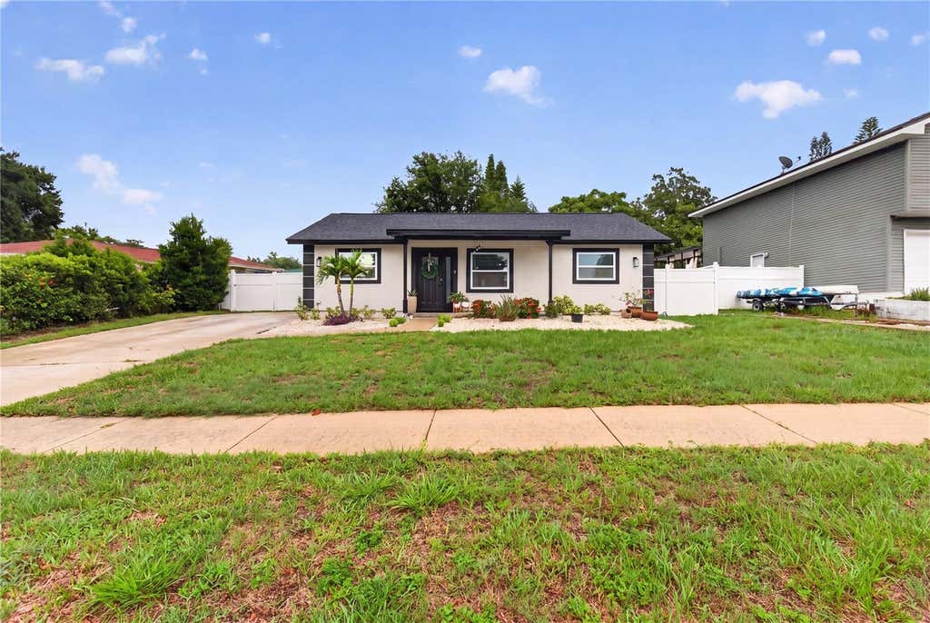 Photo of 1435 Burning Tree Road, Tarpon Springs, FL 34689 (MLS # TB8531169)