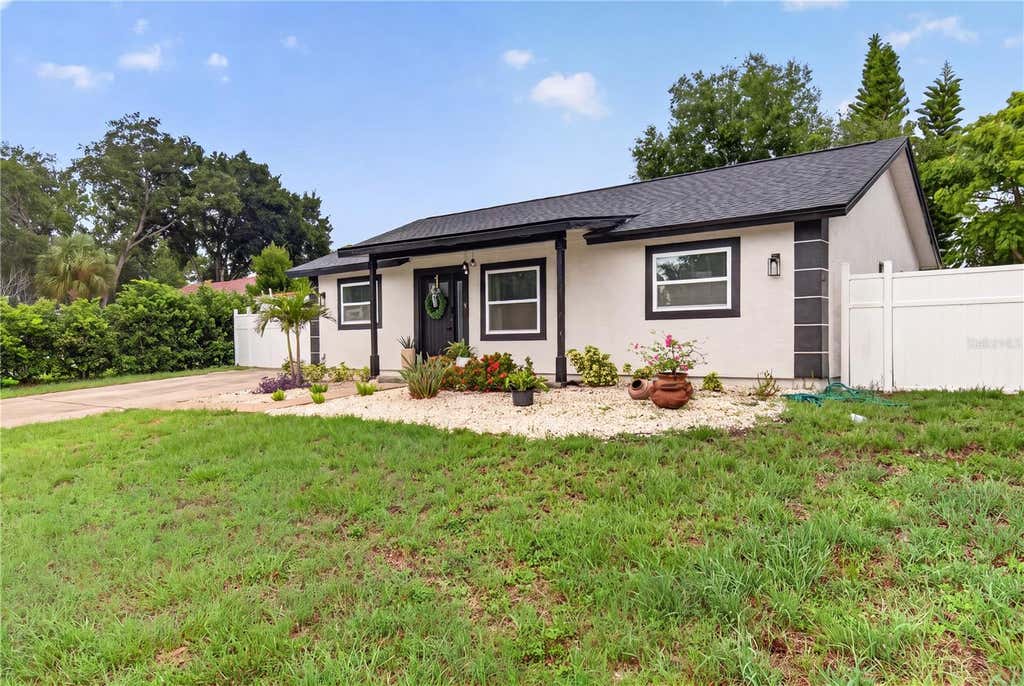 Photo of 1435 Burning Tree Road, Tarpon Springs, FL 34689 (MLS # TB8531169)