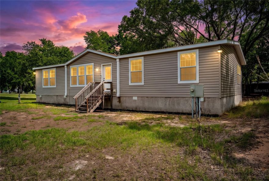 Welcome to 14002 Bay Lake Road, where peaceful country living, privacy, and endless possibilities come together on approximately 3.5 beautiful acres in the heart of Groveland. Zoned for horses and livestock, this property offers the freedom and flexibility to create the lifestyle you've always envisioned while still being conveniently located near shopping, dining, schools, and major roadways.

Inside, you'll find a spacious and inviting floor plan designed for comfortable everyday living and effortless entertaining. The large kitchen features abundant cabinetry, generous counter space, and plenty of room to gather with family and friends. The expansive primary suite provides a relaxing retreat with ample space to unwind and recharge. The home also features a versatile fourth bedroom that can easily serve as a home office, playroom, nursery, hobby room, fitness space, or guest room, offering flexibility to fit your family's unique needs and lifestyle.

Step outside and discover what makes this property truly special. The sprawling acreage offers room for horses, livestock, gardening, recreational vehicles, boats, workshops, and all your outdoor hobbies. Whether you're dreaming of building a barn, creating your own mini farm, or simply enjoying the privacy and open space, the possibilities are endless.

Spend your evenings watching breathtaking Florida sunsets and taking in the peaceful surroundings. Enjoy the serenity of country living without sacrificing convenience, with easy access to nearby amenities and commuter routes.

If you've been searching for room to roam, space to grow, and the freedom to live life your way, 14002 Bay Lake Road is a rare opportunity to own a slice of Florida countryside with all the comforts of home.