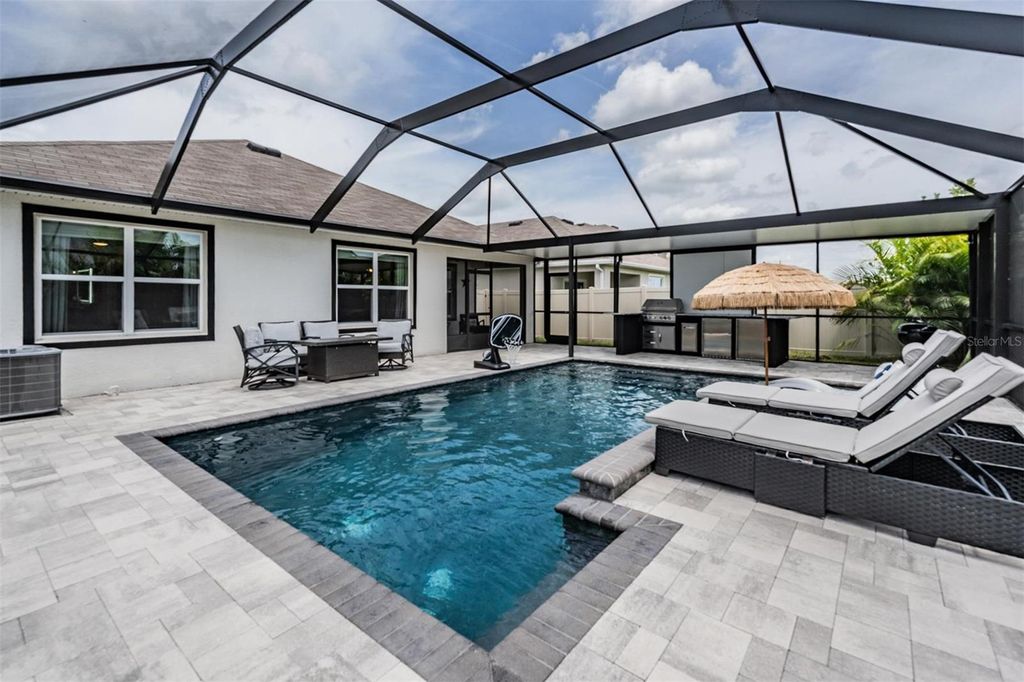 Photo of 9028 Forge Breeze Loop, Wesley Chapel, FL 33545 (MLS # TB8398599)