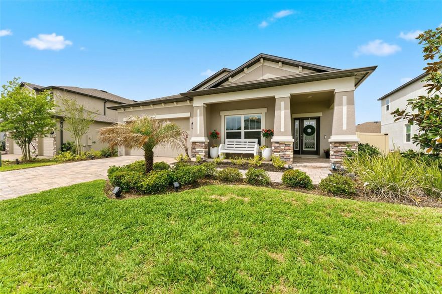 Come and discover the home you have been dreaming about! From the moment you hear the key turn in the door, you’ll know you’re unlocking “home”. Situated on a premier lot with a tranquil POND VIEW, this MOVE-IN-READY 3 Bedroom + BONUS ROOM home shows like a model home!  Upon entering, you will love the highly desirable open floor plan with a spacious GREAT ROOM appeal. Spectacularly designed, the kitchen flows into the dining room and living room over a large center island with seating for everyone. The kitchen possesses coastal linen cabinetry, granite countertops, a glass tile backsplash, and stainless steel appliances. This center island will become the center of your family life for nightly homework projects, late night dinners and Saturday morning pancakes. Neutral coastal palettes flow through the entire home and one can’t ignore the volume ceilings and oversized primary bedroom. The owner’s suite offers additional space for a cozy retreat and a large en-suite bathroom complete with a step-in shower, dual sinks and a bathtub . The BONUS ROOM has plenty of space to creatively imagine a home office, art studio, kid’s playroom, or an additional TV room.  Stepping into the backyard, with the peaceful pond setting, it’s fully fenced for your furry friends and little ones alike. Plus, the covered patio area is ideal for your summer BBQ’s and alfresco style dining! There's nothing not to love about this beautifully designed home. Unexpected Extras Include: SMART thermostat, a reverse osmosis water filtration system, NO Flood Insurance Required, Recessed Lighting, 5’ baseboards and resort-style amenities in the Talavera community. Talavera residents enjoy a zero-entry pool, splash pad, clubhouse, cabanas, tennis and basketball courts, playground, and weekend food trucks, with easy access to US-41, SR-52, and the Suncoast Parkway—making this exceptional home the perfect blend of lifestyle, location and move-in-ready appeal. Do not delay, schedule your private showing today!