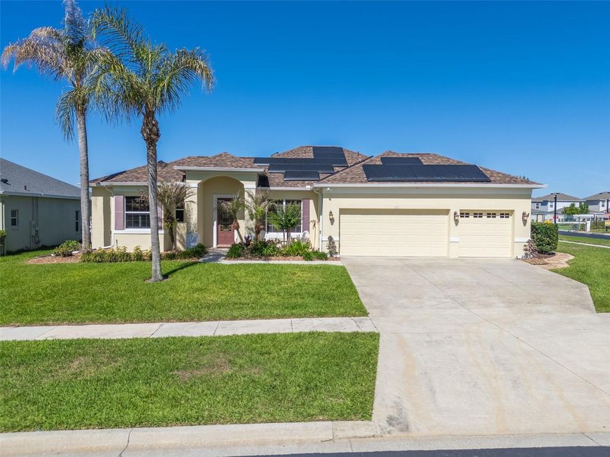 Welcome to this beautifully upgraded home located in the desirable gated community of Regency Hills in Clermont Florida with a low HOA. This property offers an exceptional blend of comfort, functionality, and luxury, with countless upgrades throughout. Situated on an oversized 0.27-acre lot, this home is filled with abundant natural light.

This well-maintained home features 3 bedrooms, 2 full bathrooms, and a spacious master suite with a tray ceiling, walk-in closet, and a luxurious master bathroom with both a shower and soaking tub. The open layout is enhanced by 24x24 coral stone flooring and extensive crown molding throughout the main living areas.

The chef’s kitchen is a true highlight, showcasing granite countertops, custom glass backsplash, stainless steel appliances, Electrolux double oven gas range, Bosch dishwasher, under cabinet lighting, and upgraded cabinetry with soft-close features.

Enjoy peace of mind with major system updates including a roof (2019), AC (2015), smart programmable thermostat, tankless gas water heater, and a whole-house water softener system.

The home also offers premium features such as built-in ceiling speakers throughout the home and lanai, California-style closets, and upgraded lighting. The 3-car garage includes a 240V EV charging outlet and upgraded lighting.

Step outside into your private outdoor retreat featuring a massive screened lanai with Italian travertine flooring, a saltwater pool with a custom stone waterfall and pool heater. A fully equipped outdoor kitchen with grill, two side burners, oversized hood/exhaust, and natural gas connection. Additional highlights include a custom outdoor dry bar with soft-close retractable cabinet doors and drawers, Tennessee fieldstone gas fireplace (natural gas connected), attached storage shed, Tesla solar panels, updated irrigation system, and new insulated sliding glass doors.

This home truly has too many upgrades to list, please see the attached feature sheet for the complete list of improvements.

Conveniently located near shopping, dining, parks, and major highways, this move-in ready home is a must-see! One or more photos have been virtually staged