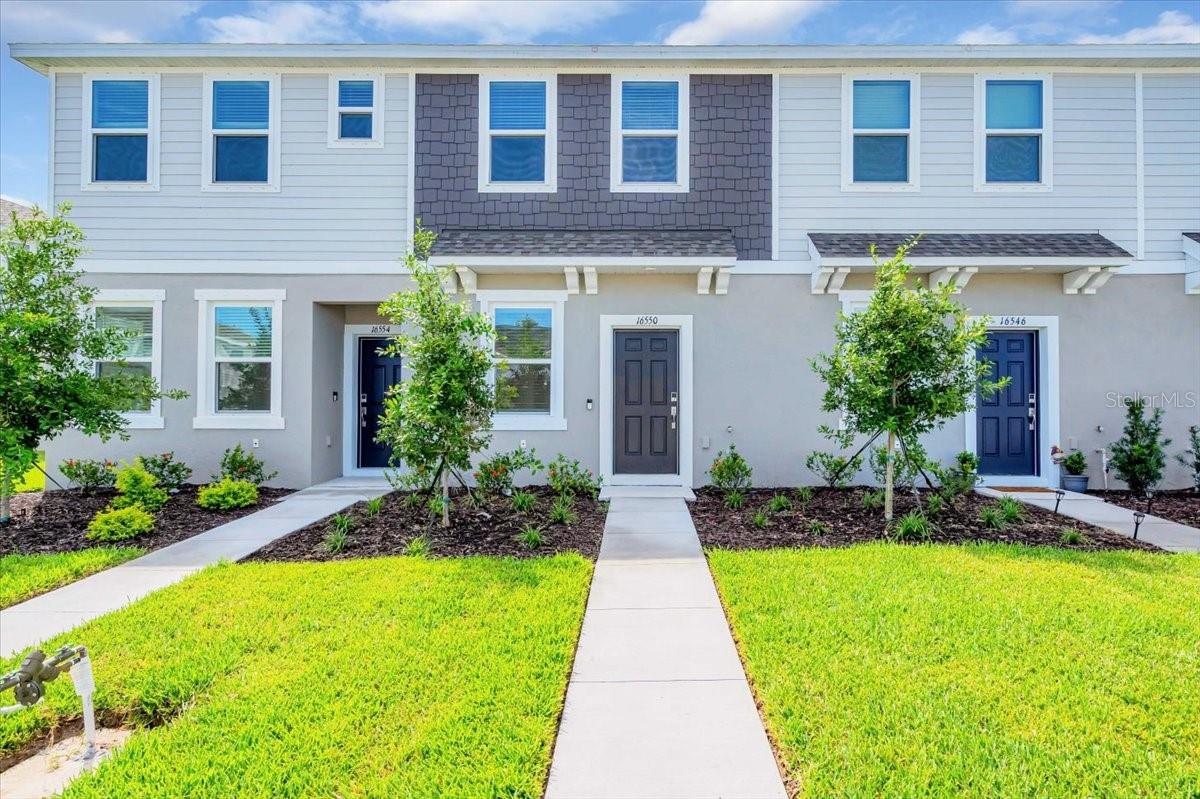 Move right in to this brand-new townhome in Lakewood Ranch’s desirable Azario neighborhood! The open-concept main level flows seamlessly into a spacious patio overlooking your semi private backyard—perfect for relaxing or entertaining. Upstairs, you’ll find two generously sized bedrooms, each with its own ensuite bath, along with the convenience of second-level laundry. Parking is simple with two dedicated spaces right in front of the home, and you’ll enjoy access to the community pool, included with rent. Experience low-maintenance living in a prime location close to all that Lakewood Ranch has to offer!