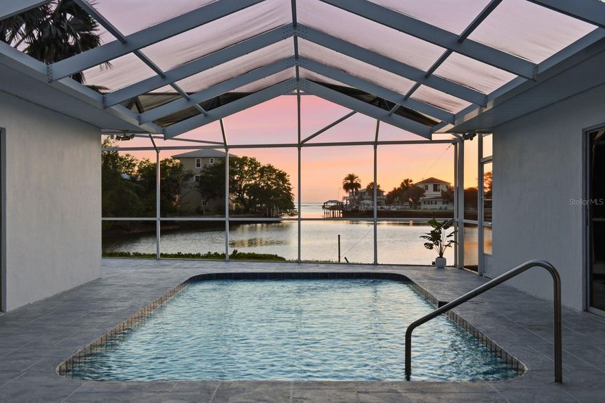 UNOBSTRUCTED GULF VIEWS | RARE WATERFRONT OPPORTUNITY | MODERN COASTAL LIVING - APPROX. 100 FEET OF WATERFRONT
This is not your typical waterfront home. Set along open Gulf waters, this residence offers true, unobstructed views of the horizon—a rare and irreplaceable vantage point with no comparable alternatives. Fully remodeled and thoughtfully designed, this coastal retreat blends modern comfort with relaxed waterfront living. Whether you’re searching for a full-time residence, vacation escape, or income-producing property, this home delivers on every level. The unique U-shaped floor plan is designed for both privacy and connection to the outdoors, with expansive Gulf and pool views from nearly every room. Inside, you’ll find wood-look porcelain tile in a soft driftwood tone throughout, complemented by crown molding and a clean, move-in-ready finish. The kitchen is designed for both everyday living and entertaining, featuring new appliances, a spacious six-seat island, and a seamless indoor-outdoor pass-through window to the pool area with extended counter space—perfect for serving and poolside dining. With 3 bedrooms and 3 full bathrooms, including two primary suites, the layout offers flexibility for guests, multigenerational living, or short-term rental use. The home also has a proven rental history with repeat guests, supporting strong income potential. The bathrooms are thoughtfully updated with walk-in showers, rainfall showerheads, and a standalone soaking tub, creating a spa-like feel throughout. THE WATERFRONT LIFESTYLE: Step outside to your private dock and enjoy direct access for boating, fishing, kayaking, or jet skiing. Set in a quiet, serene stretch of waterfront, this property offers a more peaceful and relaxed setting where you can truly take in the natural surroundings. Spend your days watching local wildlife, including birds and passing manatees, or fishing right from your dock. The screened pool area is ideal for entertaining or unwinding, where evenings are spent taking in breathtaking sunsets over unobstructed Gulf waters—each one unique and never the same twice. Nearby dining and local entertainment are just a short bike ride or walk away, making it easy to enjoy the best of coastal living while still feeling tucked away. This is a rare opportunity to own a property where the setting, view, and lifestyle all come together.
RECENT UPDATES AND FEATURES: Metal roof (2013) Electrical rewiring (2026) New HVAC ductwork (2021) Tankless water heater (2016) Newly refinished pool & deck, New pool pump (2024) Pool cage (2013) DOUBLE LOT!!! .23 ACRES!!!
Experience waterfront living at a level that is rarely available. Schedule your private showing today.