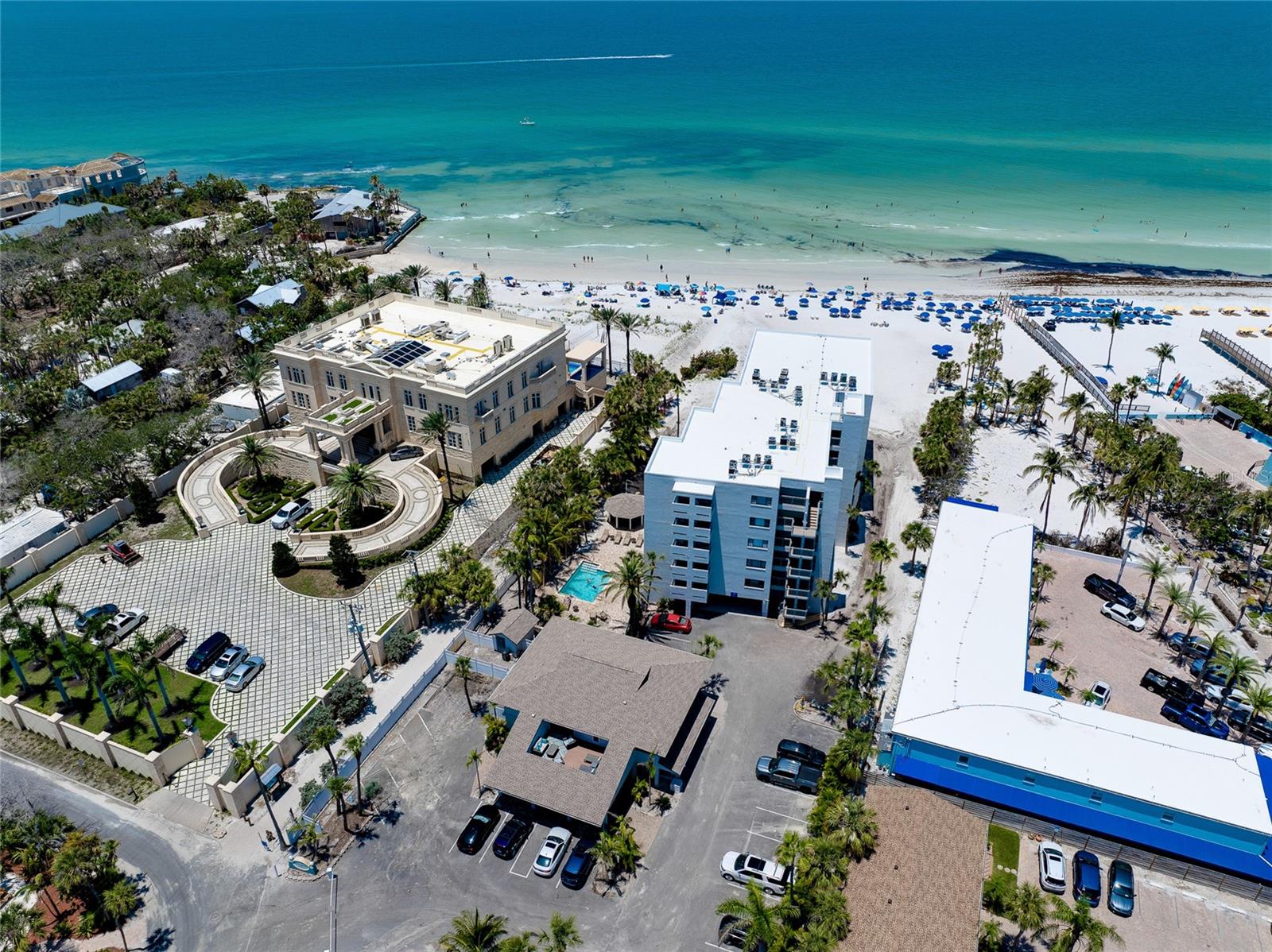 Extremely Rare Gulf-Front Opportunity at Siesta Sands Beach Resort on World-Famous Siesta Key! Don't miss this one-of-a-kind chance to own the only 3 bedroom, 2 bathroom townhome-style condo in the highly desirable Siesta Sands Beach Resort, perfectly situated directly on the shores of award-winning Siesta Key Beach. This exquisite turn-key furnished residence has been fully remodeled recently and showcases premium upgrades throughout, including elegant plank tile flooring, stunning marble countertops, high-end furnishings, and tasteful coastal décor featuring works by local artists. The bright, open split floor plan offers three patios to soak in Florida’s sunshine and Gulf breezes. Imagine starting each day with breathtaking beach views right from your master bedroom or your attached patio — a perfect way to wake up in paradise! Designed for both comfort and functionality, this condo features spacious bedrooms, ample closet space, and additional air-conditioned storage off the patio, a large laundry room, plus an assigned carport with extra storage and electric hookup. Even all of the newer windows and sliders are hurricane impact. Whether you're seeking a lucrative vacation rental investment or a private beachside retreat, this unit offers unmatched versatility. Siesta Sands is one of the top-performing rental communities on the island, allowing short-term rentals with a 3-day minimum. At Siesta Sands you can benefit from a strong rental history, high occupancy rates, and flexible management options — use the on-site office or choose your own rental service. Located steps from the iconic Point of Rocks, renowned for its snorkeling, marine life, and fishing, this gated resort community features exceptional amenities such as private beach access, two heated pools, poolside gazebo & BBQ grills, lounge area & fitness room, and high-speed WiFi. Enjoy walking or biking to nearby shops and restaurants, or take the free island trolley to explore vibrant Siesta Key Village. This is a rare investment and lifestyle opportunity in one of the most sought-after beachfront communities on Florida’s Gulf Coast. Act quickly — opportunities like this don’t come often!