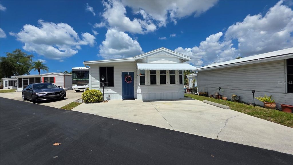 Photo of 1674 University Pkwy Lot 129 Pkwy, Sarasota, FL 34243 (MLS # A4691593)