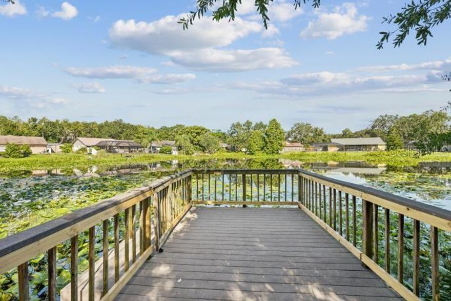 One or more photo(s) has been virtually staged. JUST REDUCED!!  Serenity and Wildlife Meet City Convenience in This Tampa Pool Home - Welcome to 12512 Sugar Pine Way, located in the desirable Country Run neighborhood of Tampa. This 4-bedroom, 3-bath pool home offers a unique blend of nature and city convenience. The expansive backyard, with its native foliage, attracts local wildlife, including blue herons, muscovy ducks, hummingbirds, and turtles. The west-facing dock on the pond is perfect for kayaking, fishing, or enjoying beautiful Florida sunsets. The home also features beautiful, large azaleas that bloom in both the front and back yards, adding vibrant color to the property.

Inside, you’ll find tons of storage, including attached storage in the side yard. The ensuite master provides a private retreat, and the large, air-conditioned Florida room boasts expansive windows along the back side of the house, offering serene views of the pool and backyard.

While the home is well-maintained, it’s a great opportunity for you to personalize and update to your taste. Situated near Carrollwood and Northdale, this home offers easy access to the Veterans Expressway, making commuting a breeze. You’re just a short drive from shopping, dining, and Tampa International Airport, with Florida's beautiful beaches only an hour away—perfect for a day trip.

Enjoy the freedom of no HOA or CDD fees, with no flood insurance required. This is your chance to create your dream home in a prime location with all the benefits of city living nearby.