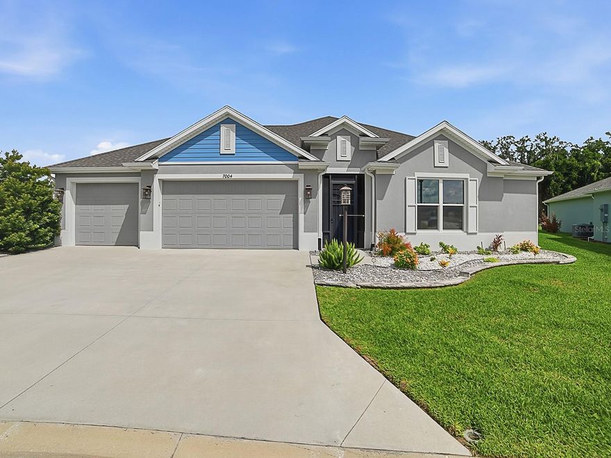 Welcome to luxury living in The Villages! Ideally located just minutes by golf cart from Eastport Town Square, this beautifully maintained 3-bedroom, 2.5-bath home offers an exceptional blend of elegance, comfort, and resort-style amenities.

Designed with an open, light-filled floor plan, the home features ceramic tile flooring, QUARTZ COUNTER TOPS, custom crown molding, soaring 10-foot ceilings, and powered zebra blinds throughout. The spacious chef's kitchen is a dream for entertaining, showcasing beautiful countertops, enhanced appliances, abundant cabinetry, and a large walk-in pantry.

The private owner's suite offers a spa-inspired retreat with a walk-in Roman shower and generous closet space. Every detail of this home reflects quality craftsmanship and meticulous care.

Enjoy year-round indoor-outdoor living in the expansive 365-square-foot glass-enclosed, tiled lanai featuring its own split A/C system. Step outside to your private backyard paradise, complete with a heated and cooled saltwater pool featuring a sun shelf, a custom natural stone waterfall, and a Vita Riviera spa with Bluetooth capability and advanced ozone/UV water purification.

Additional premium features include an expanded 3-car garage, Solaris iAQ whole-home air quality system with ion generator and ultraviolet lamp, and a transferable 5-year extended HVAC warranty for added peace of mind.

Set on a generously sized homesite in one of The Villages' most exciting and rapidly growing areas, this exceptional residence offers convenient access to championship golf, recreation centers, dining, shopping, entertainment, pickleball, and all the unmatched amenities that make The Villages.

This is Florida luxury living at its finest.
