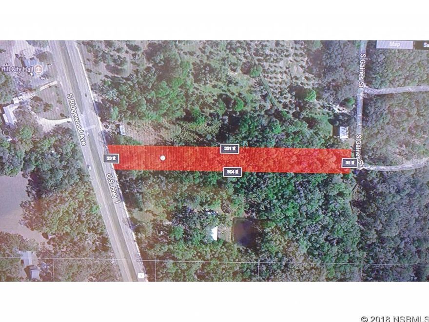 Great price on this commercial property ready for you to build on in Florida! Close to beach, yet sits high and dry. Build your dream business with 99 feet of road frontage on busy US 1. Plenty of depth so you can have a long driveway, more buildings, or lots of parking. So many Possibilities! Many uses in this Commercially zoned parcel, just use your imagination! Just 1/2 mile South of Oak Hill light and south east of the Oak Hill City Hall. Motivated Seller. Need more room? Adjacent lots may also be available. Why not take a look?; Cleared: No ;Water: Available at Site