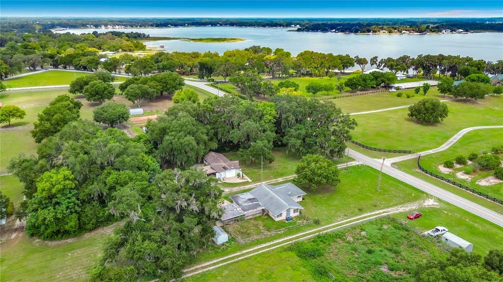 Photo of 11900 SE Sunset Harbor Road, Weirsdale, FL 32195 (MLS # OM729787)