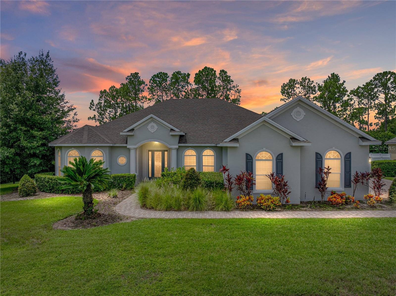 Welcome to 117 Melissa Trail, a beautifully upgraded custom home located in the highly sought-after gated community of Lake Arietta Reserve. This thoughtfully designed single-story residence offers three bedrooms, two bathrooms, a private office that could serve as a fourth bedroom or nursery, and an oversized three-car garage, all situated on an expansive 0.41-acre lot. From the moment you arrive, the paver driveway, mature landscaping, and elegant architecture create a striking first impression.
Inside, you’ll find a spacious open layout with ten-foot ceilings, crown molding throughout, and luxury vinyl plank flooring recently installed in the main living areas. The formal dining room sits just off the entryway, paired with a bright breakfast nook overlooking the lanai. At the heart of the home, the kitchen has been beautifully remodeled with granite countertops, premium wood cabinetry, a large peninsula island, and a generous walk-in pantry, perfect for hosting and everyday living.
The private owner’s suite includes a sitting area, dual walk-in closets, a spacious walk-in shower, double vanities, and a built-in dry heat sauna that replaces the traditional tub—offering a spa-like retreat in your own home. French doors from the great room, hallway bath, and master suite lead to the newly completed screened-in saltwater pool and hot tub, finished in 2022 and surrounded by an oversized paver lanai with child safety fencing. The fully fenced backyard is ideal for entertaining and relaxing, with a separate grilling patio and a gated side yard offering boat or trailer parking behind a double PVC privacy fence. The ground in the storage area has been updated with fresh shell, making it both practical and low-maintenance.
Additional upgrades include a new architectural shingle roof installed in 2020, a completely replaced HVAC system in 2022, a new water heater, cooktop, dishwasher, and refrigerator in 2023, fresh interior paint in 2021, and new exterior paint in 2022. The oversized three-car garage provides ample built-in shelving and attic storage above, while the full lawn irrigation system keeps the grounds looking pristine. Homeowners in Lake Arietta Reserve enjoy private access to the lake through the neighborhood’s exclusive boat ramp. This exceptional home offers a rare blend of elegance, functionality, and premium upgrades in one of Auburndale’s most desirable communities.
