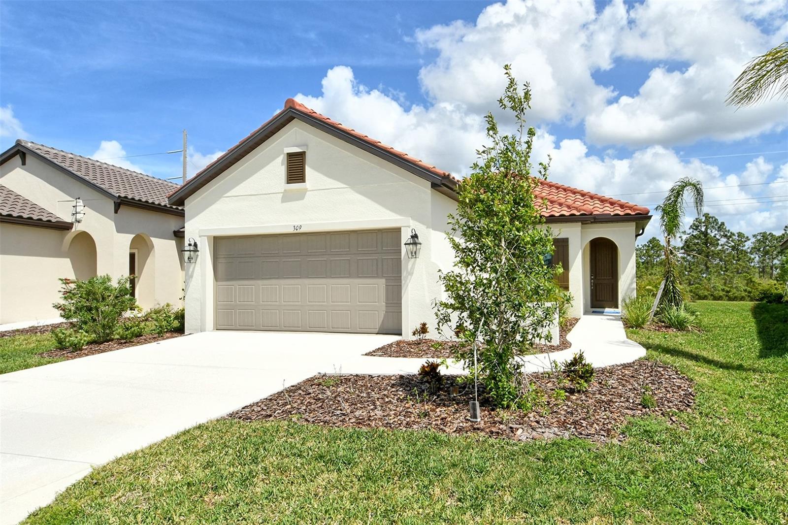 This beautifully designed 3-bedroom, 2-bath home offers modern elegance and everyday comfort. Enjoy wood-look tile flooring throughout and quartz countertops in both the kitchen and bathrooms, all set against a neutral, professionally selected color palette.
The open great room features recessed ceilings, adding architectural interest and a spacious feel. Step outside to the extended lanai, already equipped with rough-ins for an outdoor kitchen, making it easy to create your perfect entertaining space.
With impact glass for added peace of mind and a serene natural preserve view from the lanai, this home offers both privacy and style in one beautiful package.